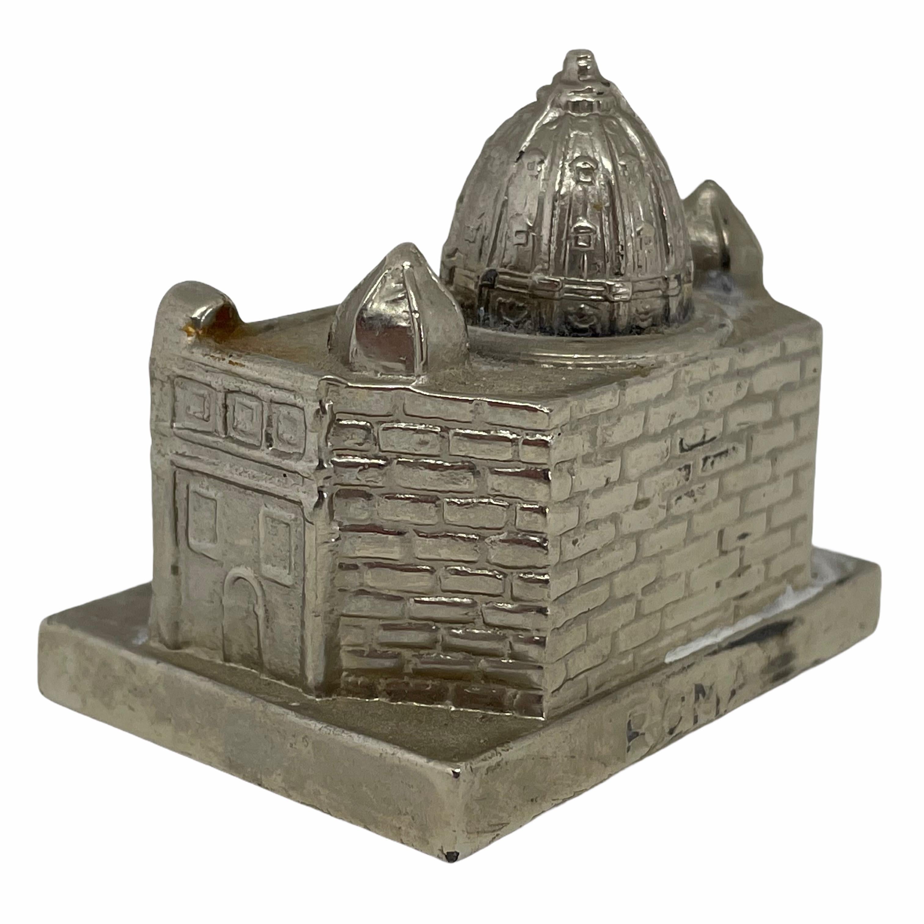 A 1960s souvenir building architectural model. Some wear with a nice patina, but this is old-age. Made of metal. A beautiful nice desktop item or just a display item in your collections of souvenirs from around the world.

 
