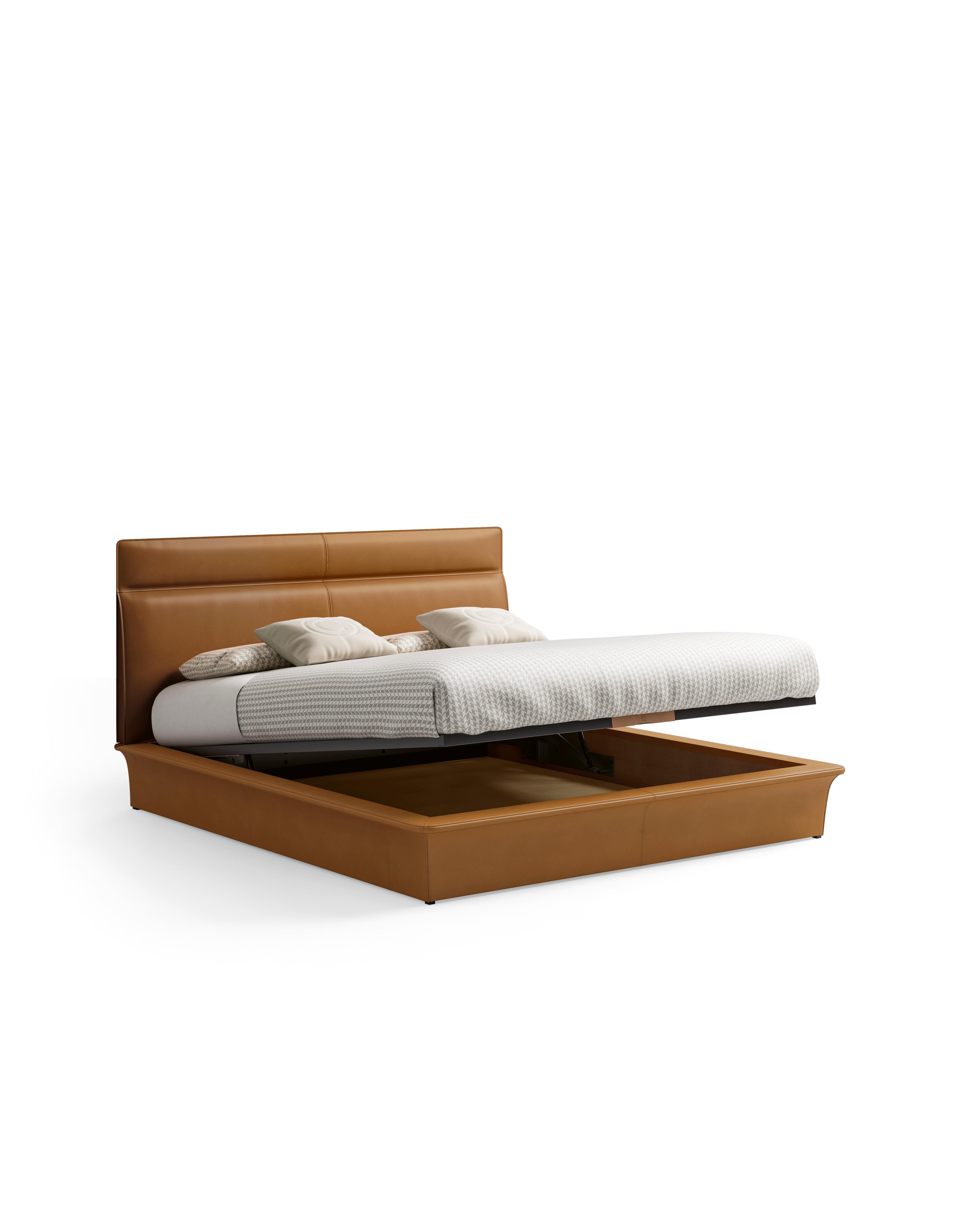 A bed with storage box feature, designed for both functionality and style. The entire structure is elegantly wrapped in premium saddle leather, giving it a luxurious and sophisticated appearance. The bed includes a convenient storage compartment