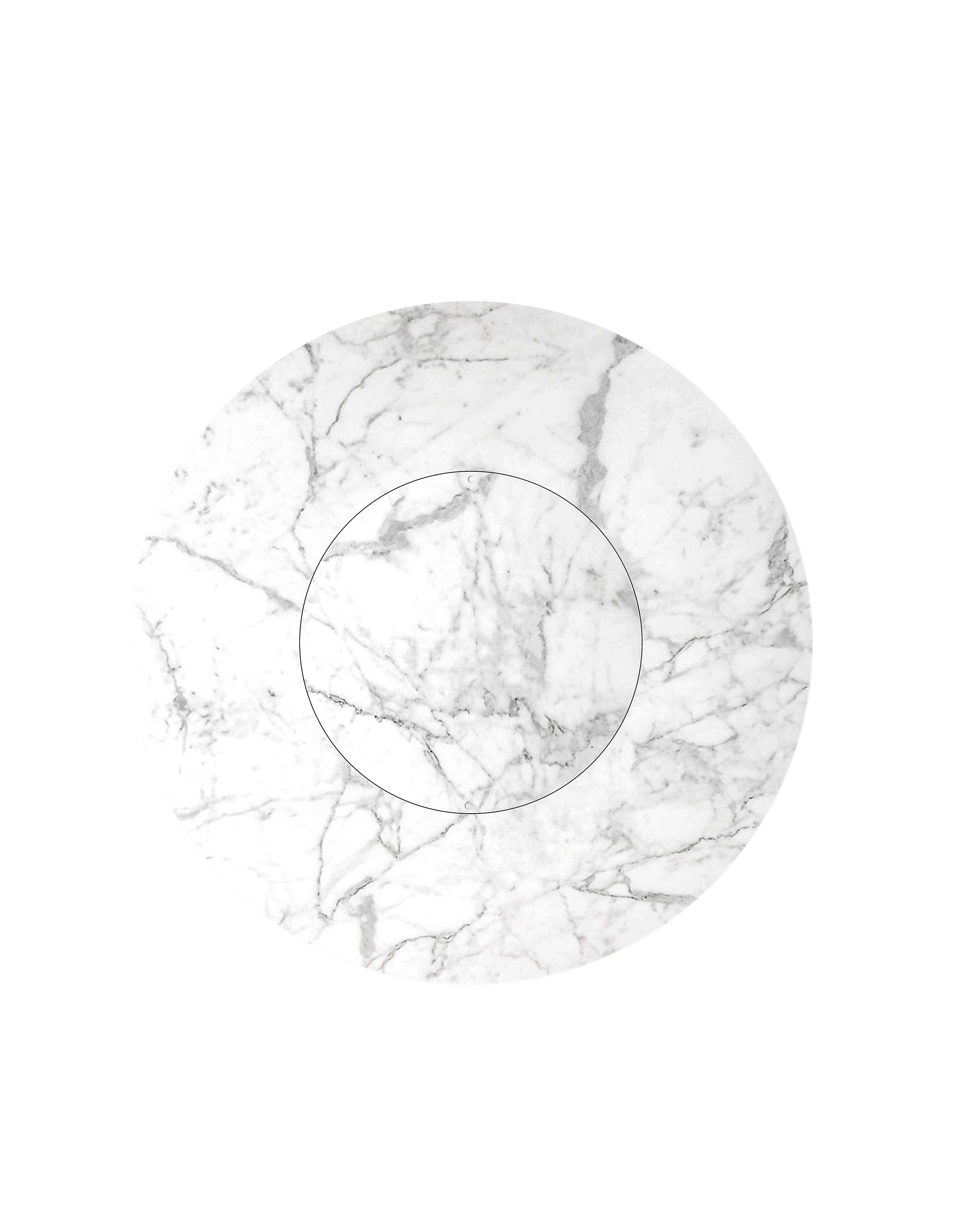 A round dining table with a marble top, featuring a saddle leather-wrapped structure and a metal base. The table's elegant marble surface gives it a sophisticated, timeless look, while the saddle leather-covered frame adds warmth and texture. The