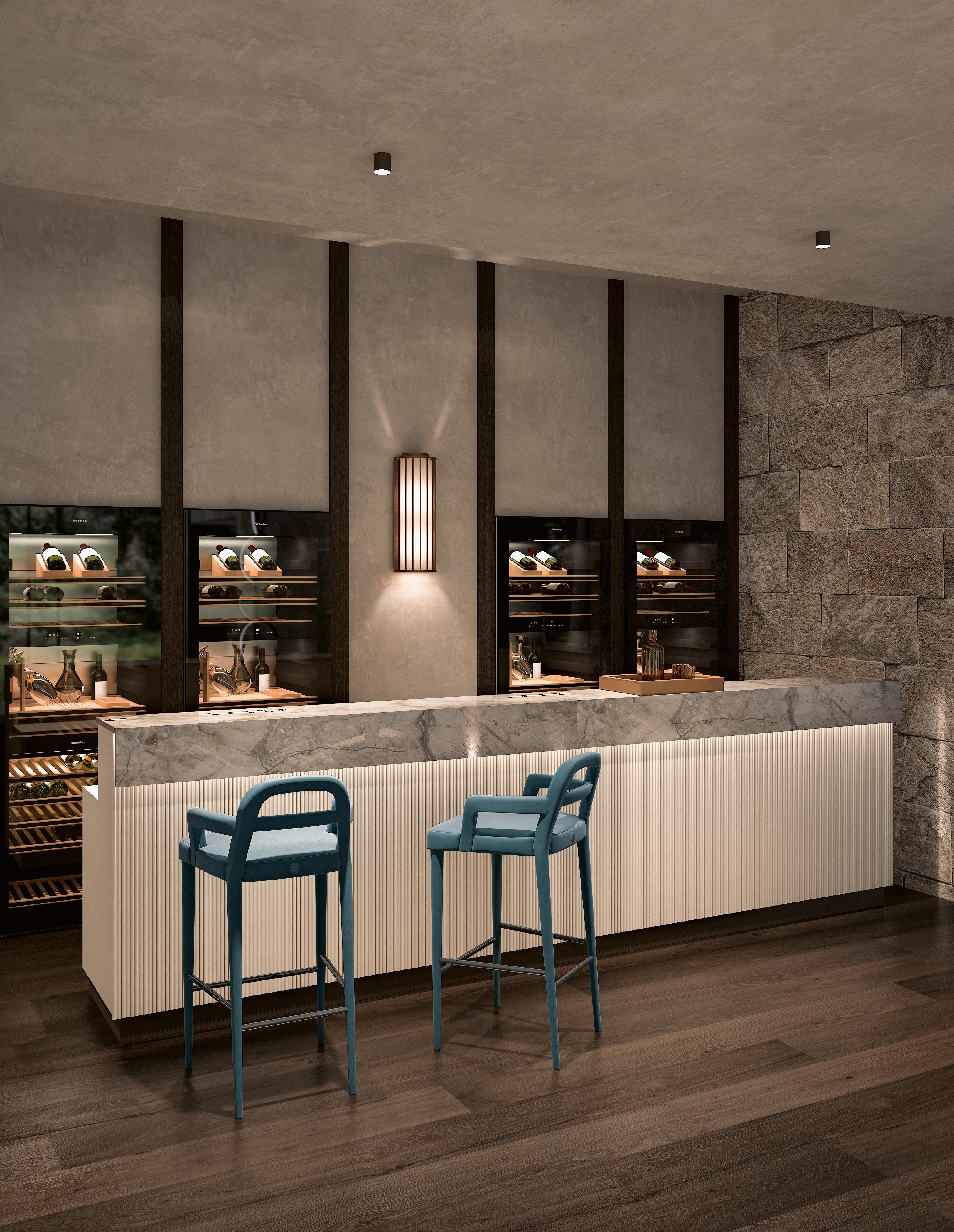 A bar stool fully upholstered in fabric, featuring a sleek and modern design. The stool offers a comfortable and stylish seating option, with a soft, fabric-covered seat and backrest that provide both support and relaxation. The upholstery can come