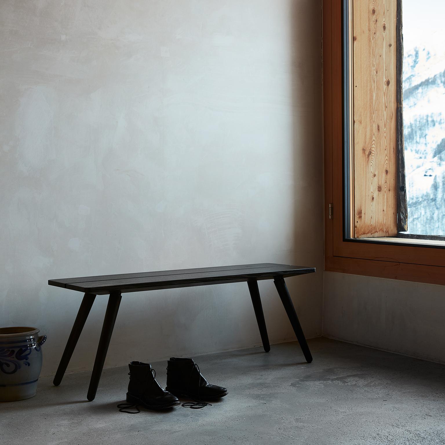 Our Stabellenbank, or stable bench, is a modern twist on a Swiss Classic, widely found in homes, farms and taverns. It is held together by four hand-turned legs and strong joinery, made from 100% solid European ash. Any weight applied to the seat