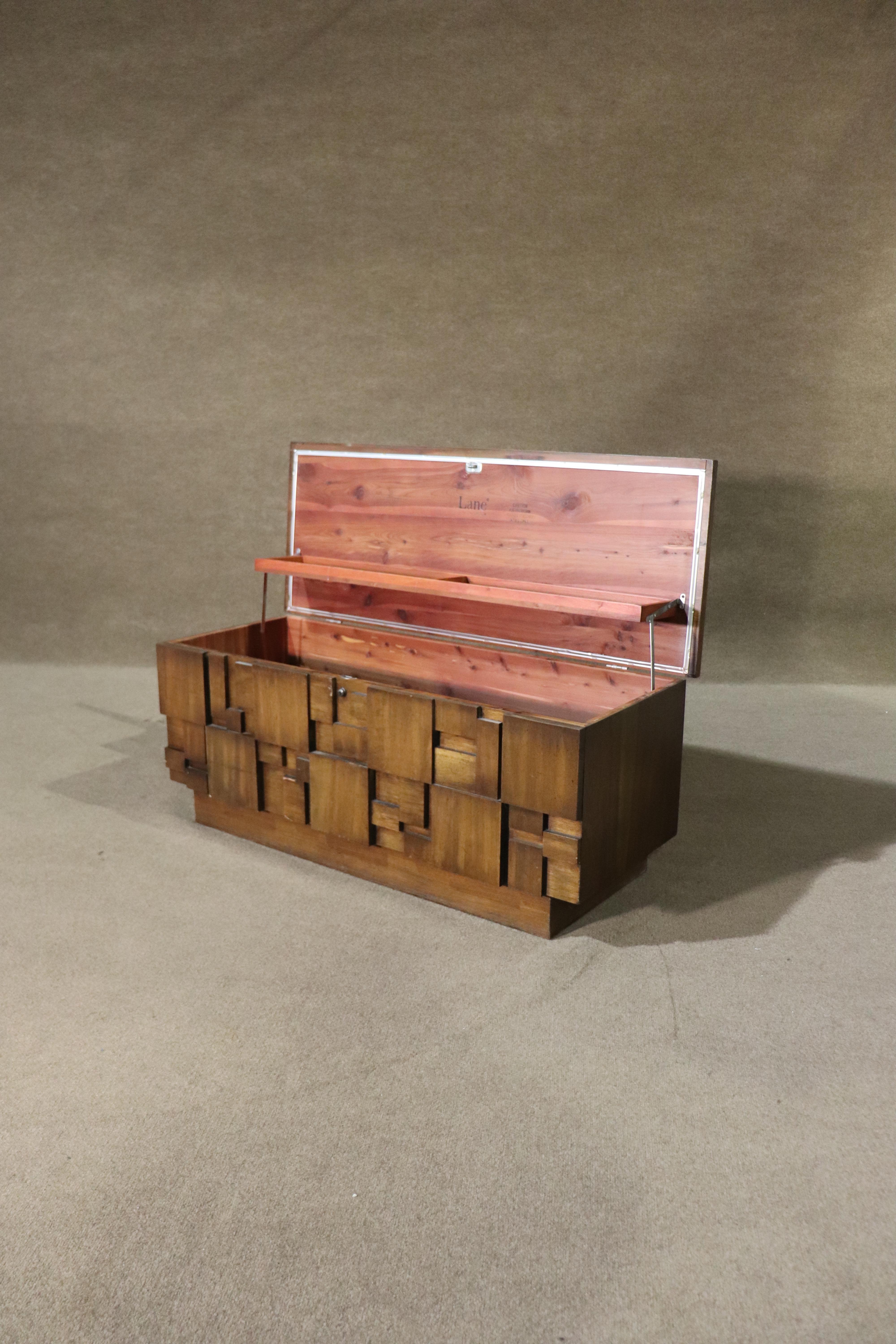 Three dimensional mid-century modern cedar chest by Lane Furniture. Part of their 'Staccato' line, which features a mosaic front, push button top, and cedar lined inside.
Please confirm location NY or NJ