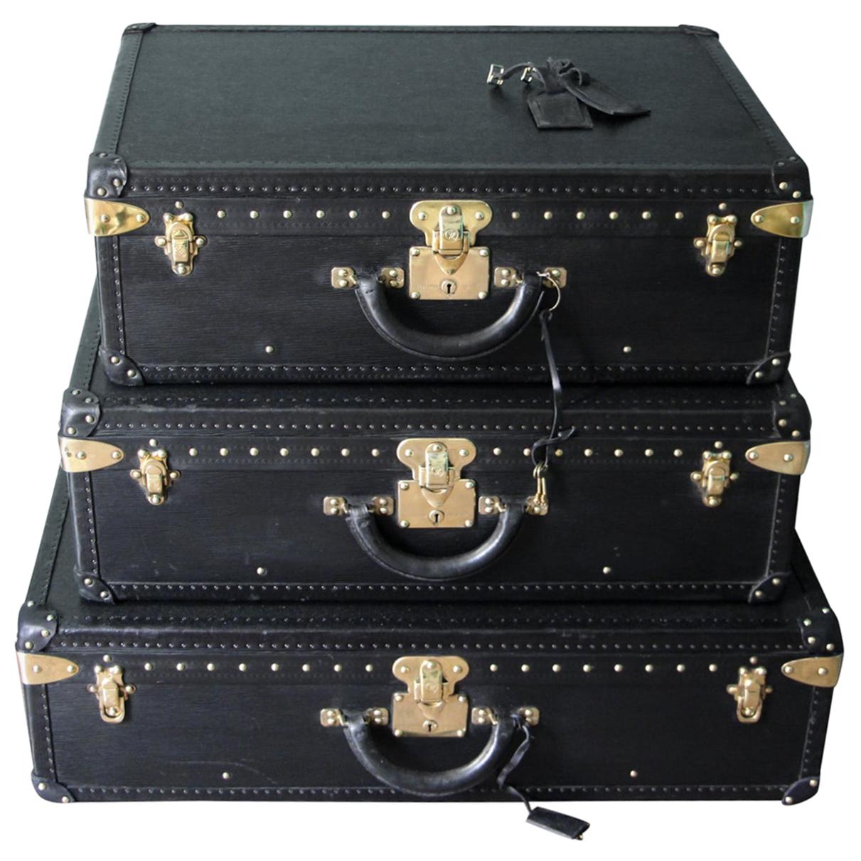 Stack of Black Louis Vuitton Alzer Suitcases, Louis Vuitton Trunks