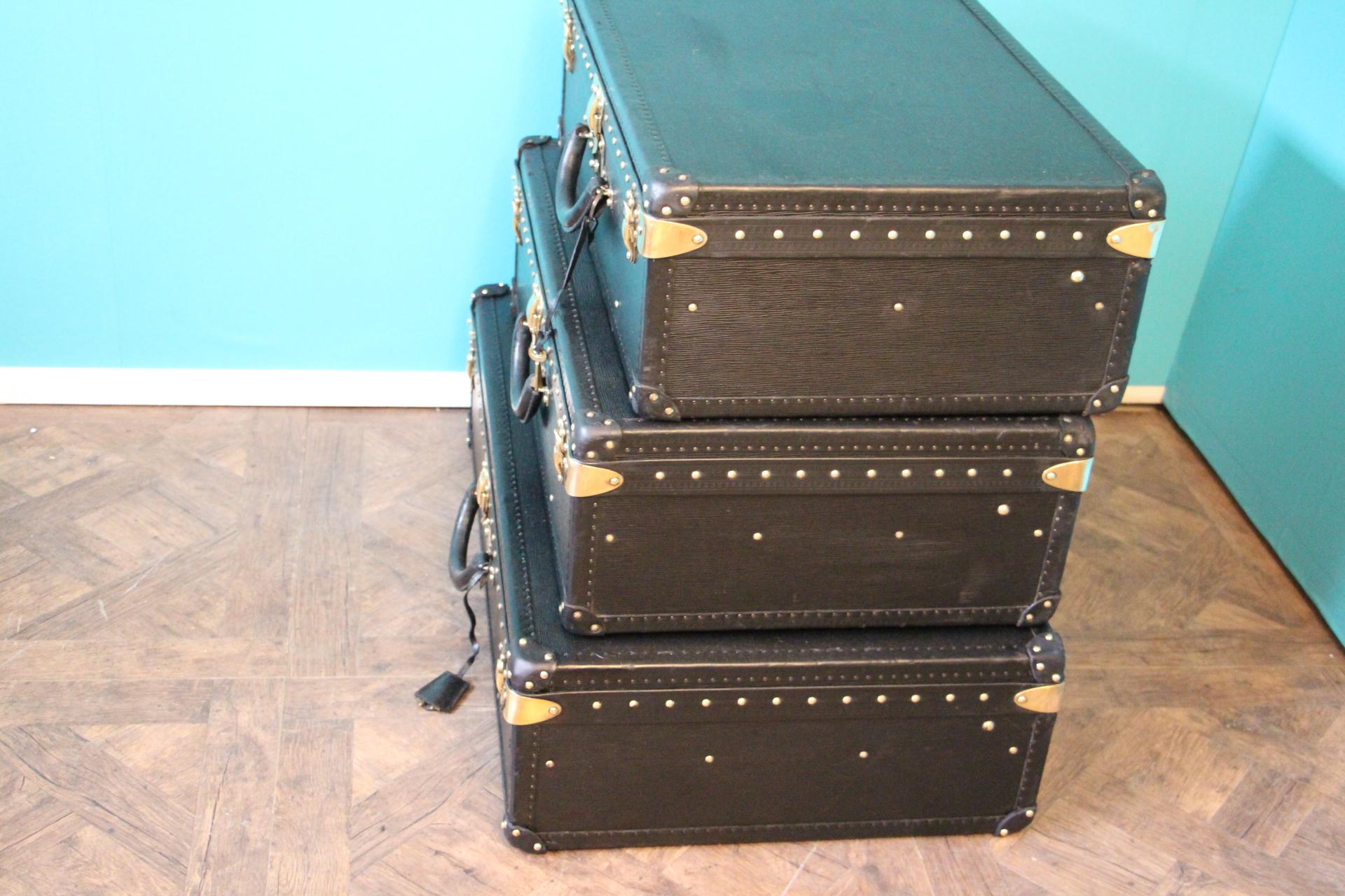 Brass Stack of Black Louis Vuitton Alzer Suitcases, Louis Vuitton Trunks Louis Vuitton