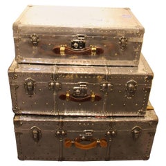 Stack of Three Polished Aluminium Steamer Trunks