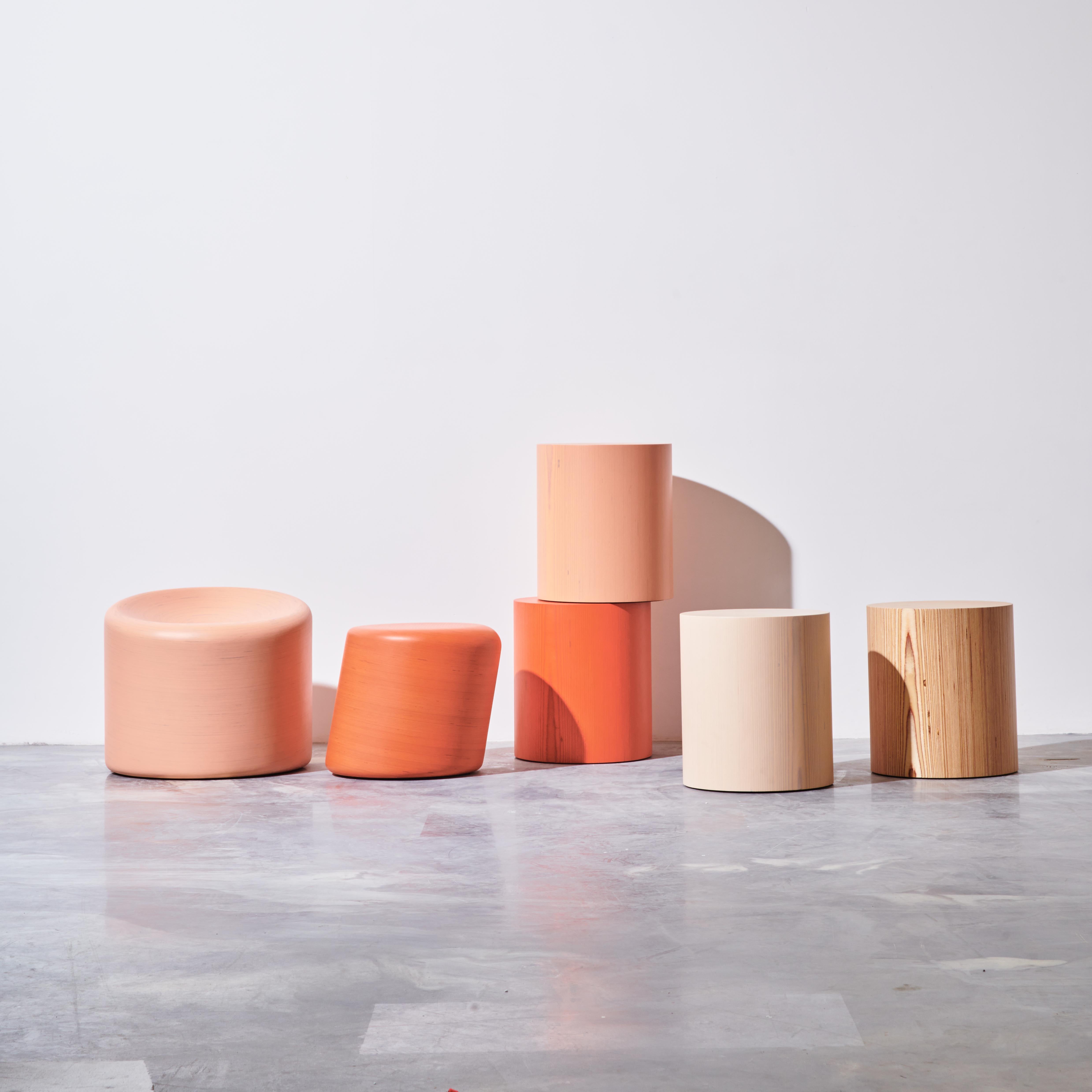 The stack seat. A stack laminated FSC Baltic Birch plywood cylinder, rotated forward with a concave seat scoop; an expression of the ergonomics of sitting in pure form. Color Pictured: Peach. 

Item available for immediate delivery.

This design is