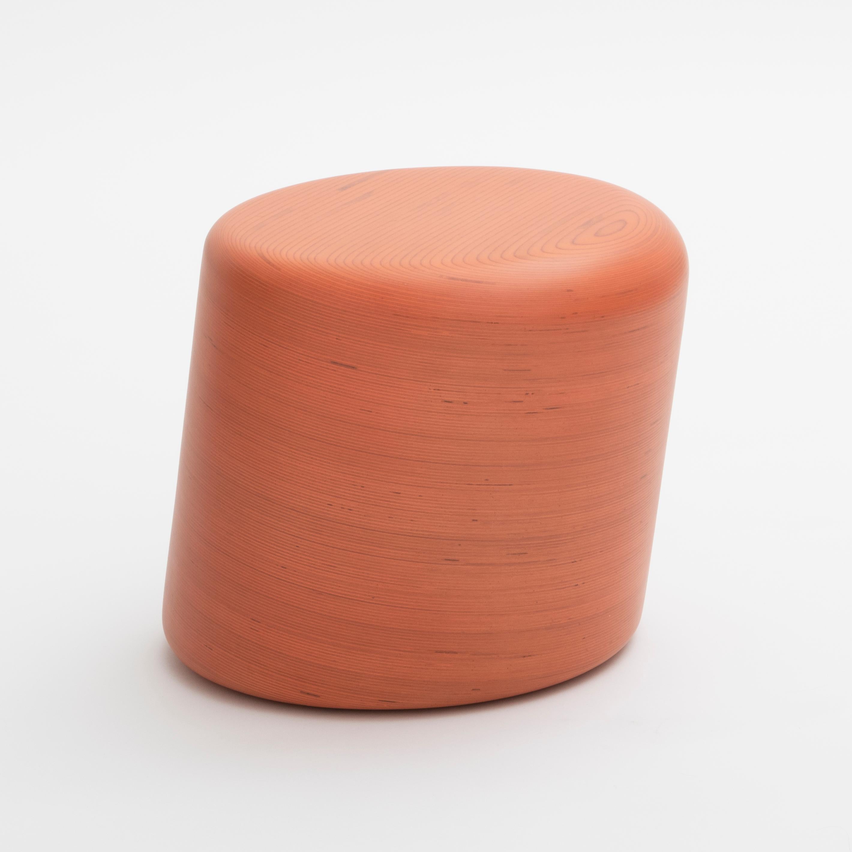 The Stack Stool. Equally suitable for use as a stool or accent side table, this piece expresses the essence of the Stack line. Stack laminated plywood in a pure cylindrical form with an ergonomic forward lean and a flat top with compound radiused