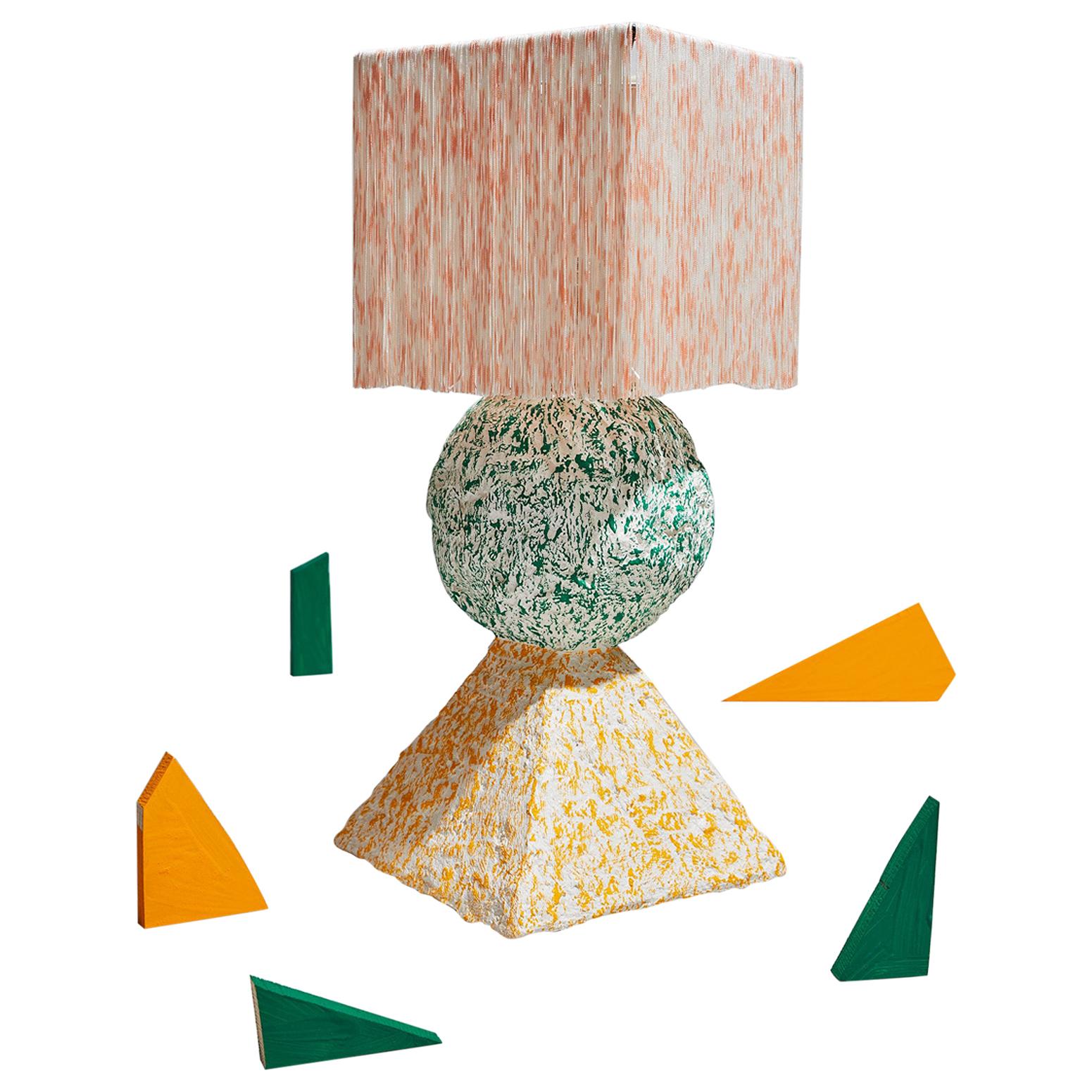 Inspired by the three foundational shapes, the pyramid, sphere and cube, The Stack Lamp takes a playful approach to balance color, pattern and form. Our Stack highlights the ephemeral and playful qualities of its architectural composition. 

A