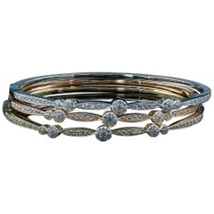 Stackable 18 Karat Gold and Diamond Bangles Featuring 0.65 Carat of VS Diamonds