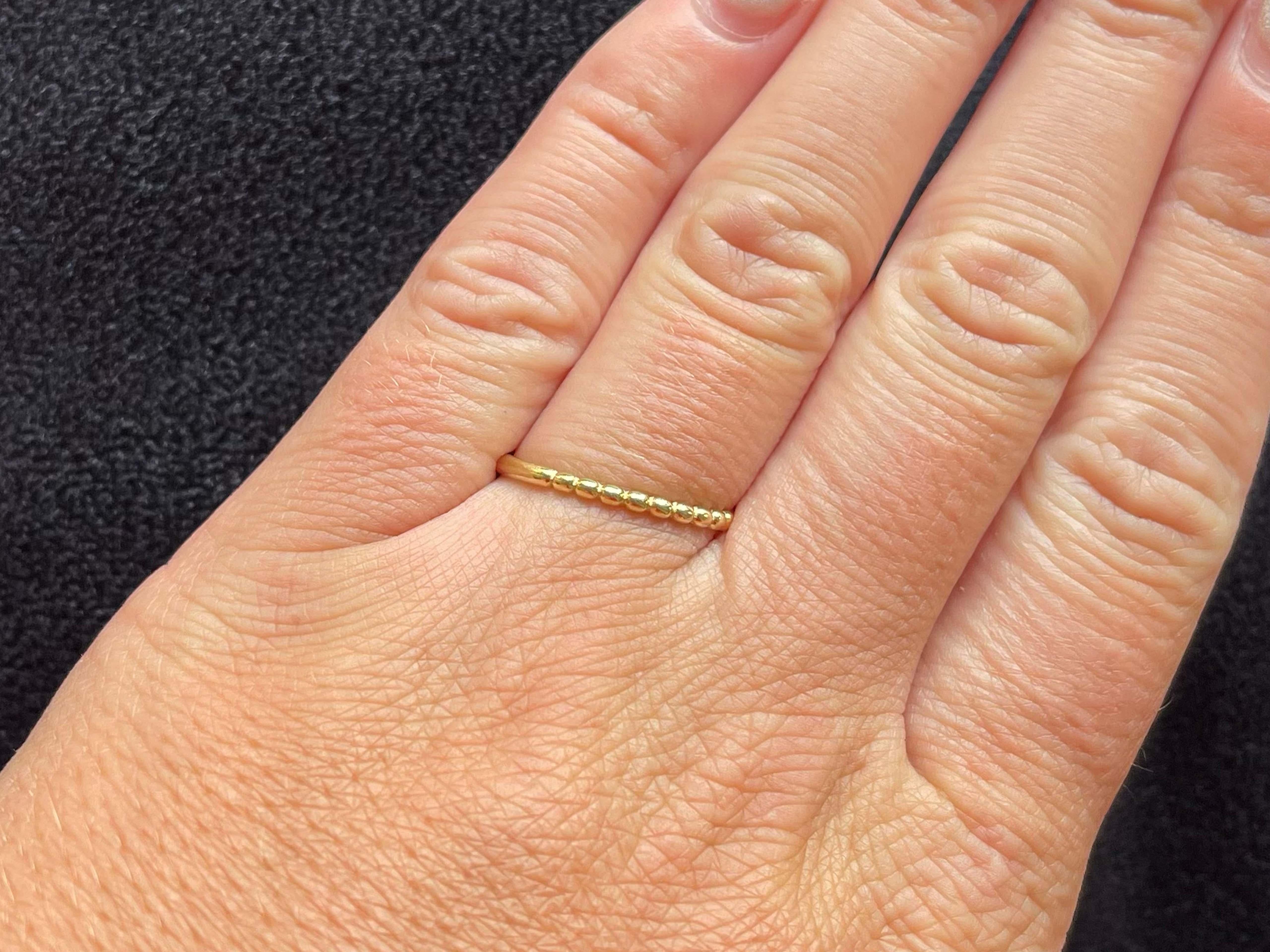 Item Specifications:

Metal: 18K Yellow Gold

Ring Size: 8

Total Weight: 1.1 Grams

Condition: Preowned, excellent

Stamped: 