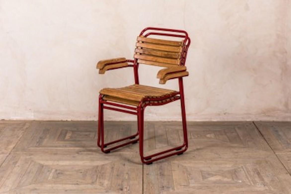 A fine stackable chair with arms, 20th century.

These stackable chairs with arms are available in a selection of funky colours and are sure to brighten up any space. The chairs and they're manufactured locally in the UK, with seats made of