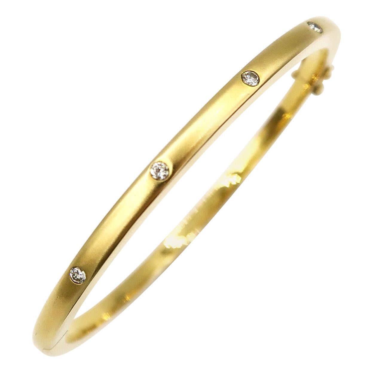 Stackable Matte Thin Bangle in 18k Yellow Gold with Diamonds Evenly Spaced For Sale