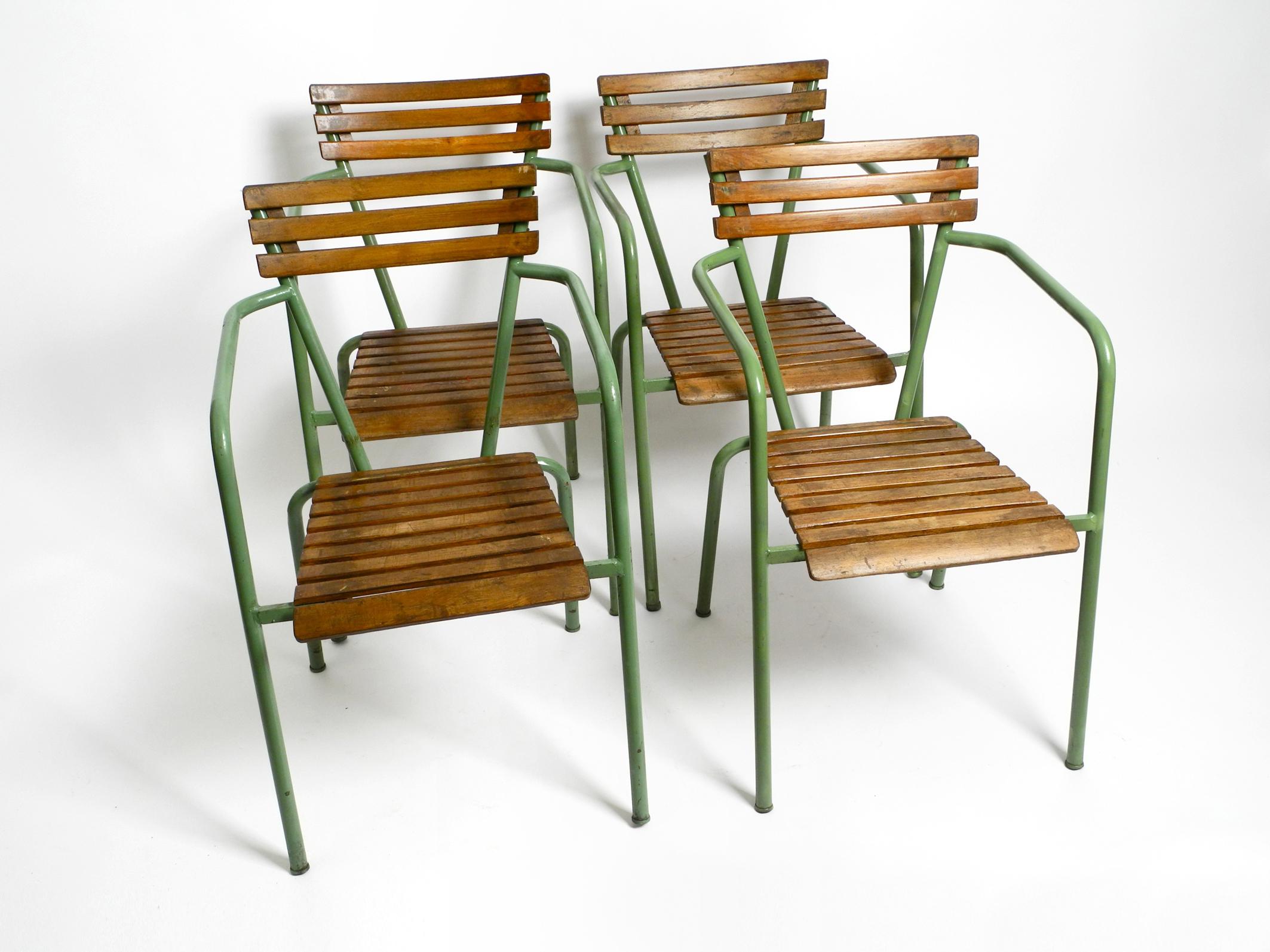 Four beautiful stackable Mid Century bistro armchairs.
Beautiful Italian design of the 1950s.
Metal tube frame. Backrest and seat are made of wood.
According to the previous owner, the frames were repainted once in the original color.
Except for the
