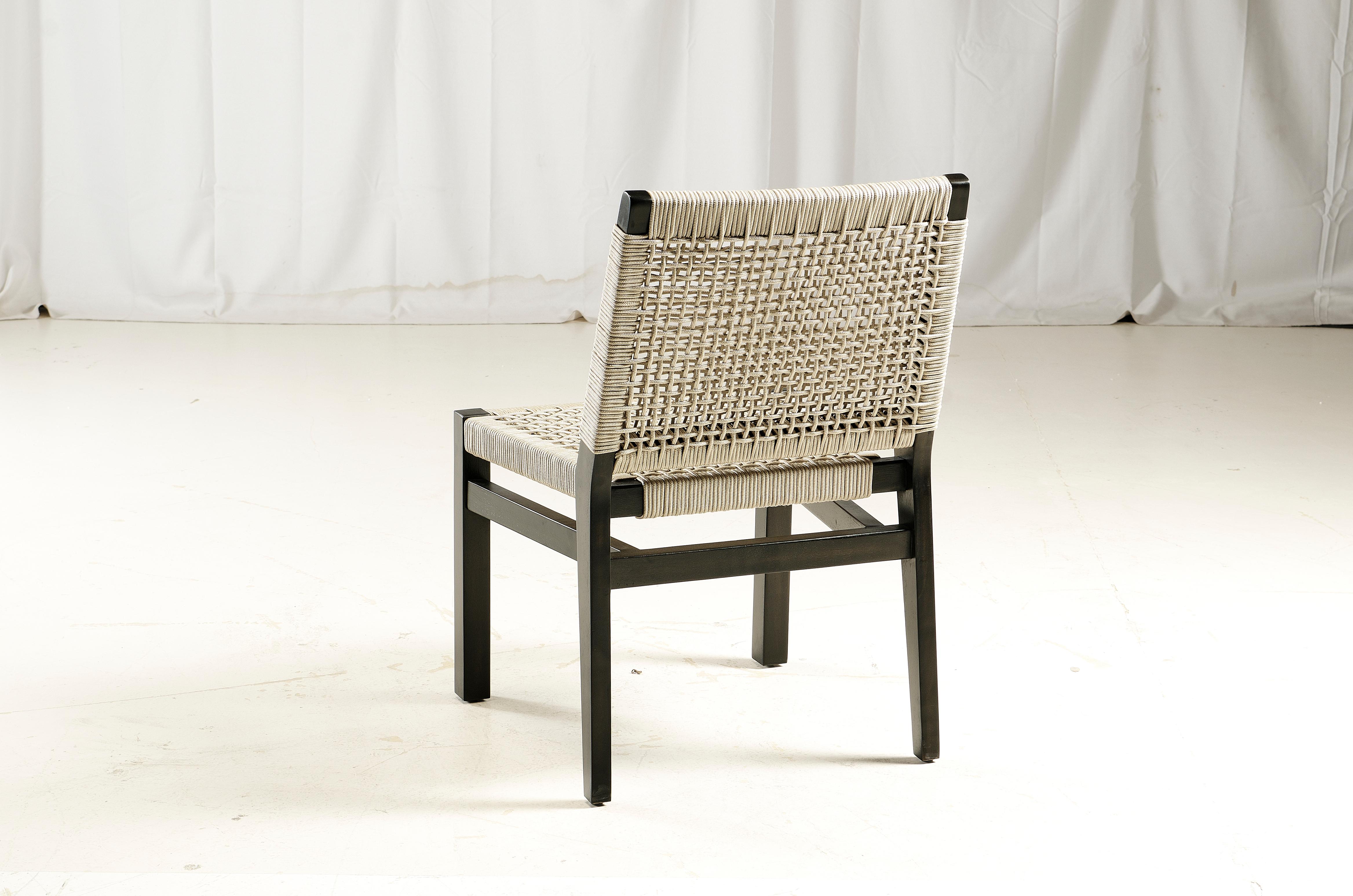 Acacia wood frame, charcoal wash. 
Synthetic rope off white color.
Rope Thickness: 4.5 mm
Contract grade chair.
Avoid chemicals when cleaning stained wood.
Contact us to enquire about COM/COL production, requirements and material shipping