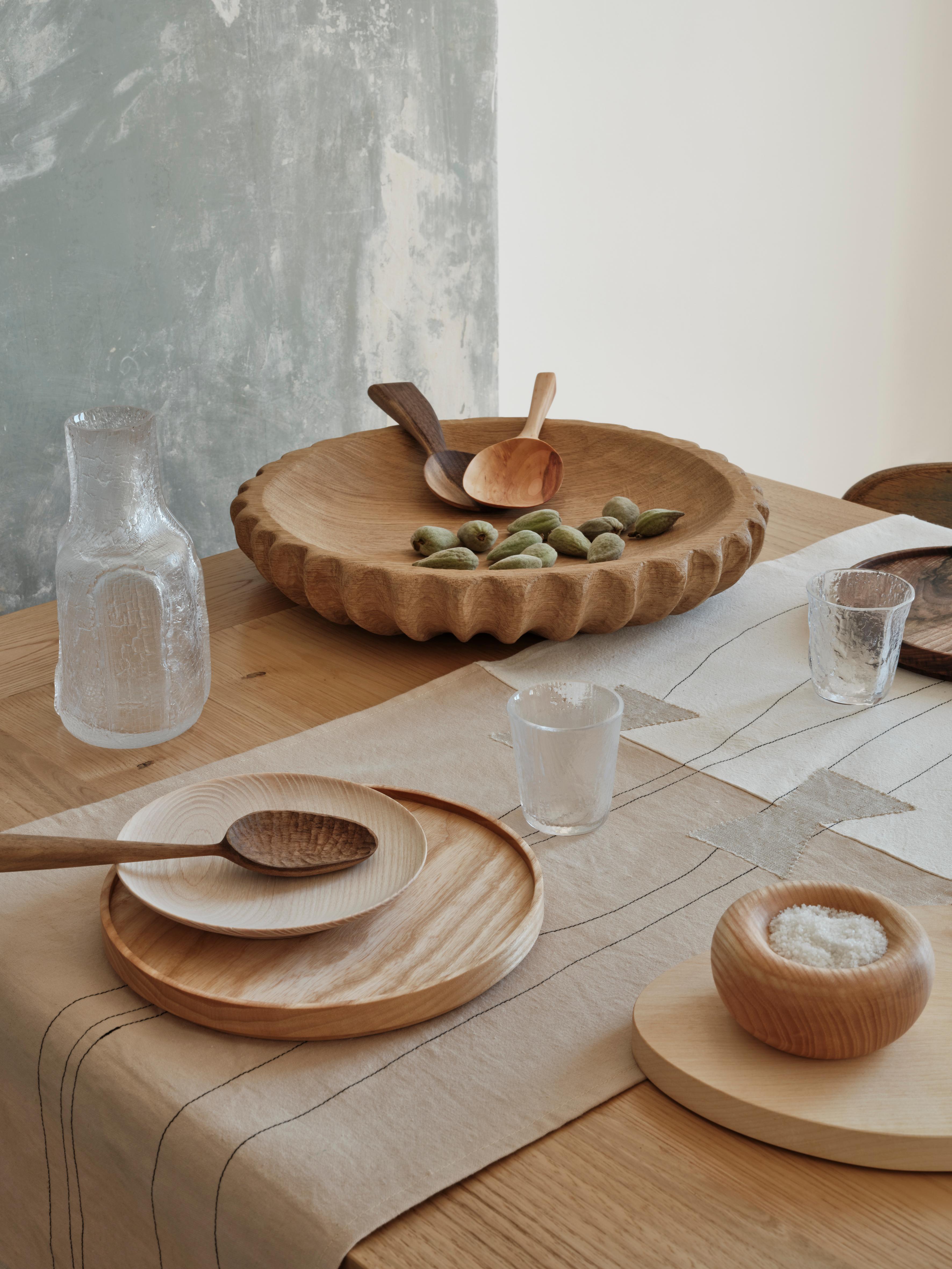 Timeless and minimalist, these ash or walnut plates can be stacked as desired. Imagined by OROS Edition, they were turned by Baptiste André, craftsman based in the Jura in France. 
Protected by oil, they are suitable for food use.

As wood is a