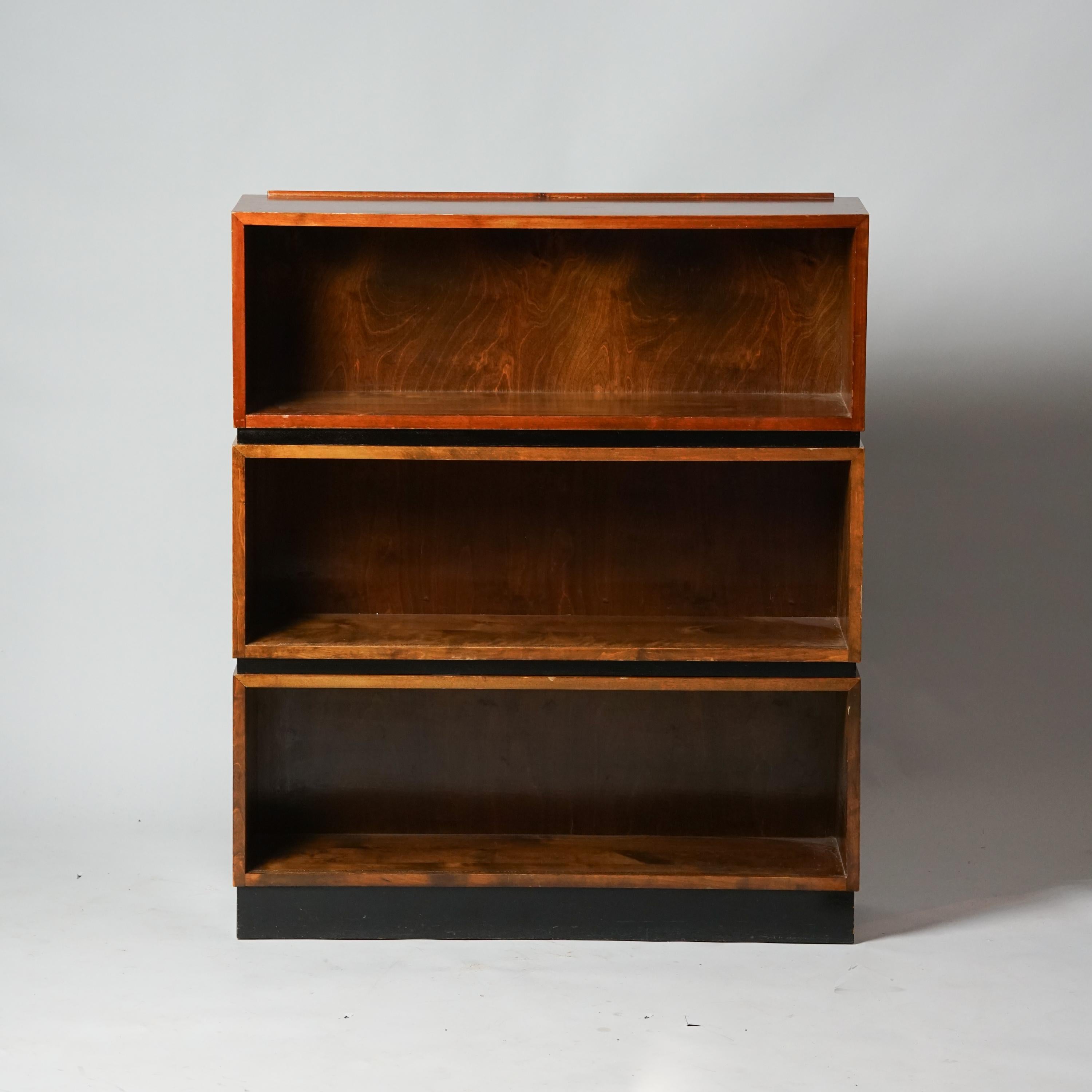 Stackable Shelves, designed by Aino Aalto, manufactured by Oy Huonekalu- ja Rakennustyötehdas Ab, 1940s. Stained birch. The shelves are sold as a set of three. Good vintage condition, minor patina and wear consistent with age and use. 
Measurements: