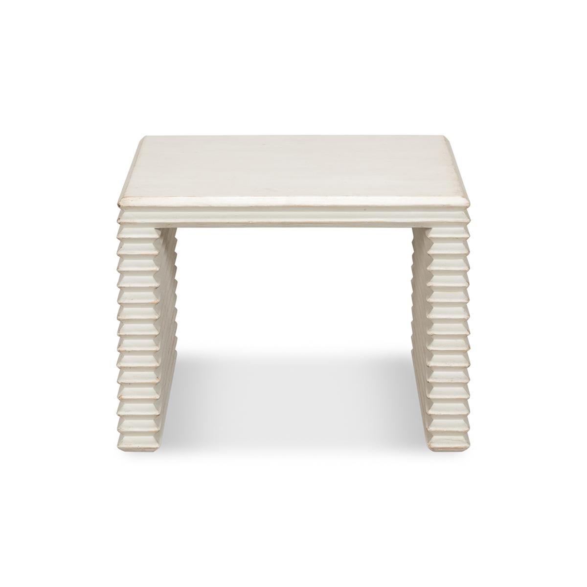 Stacked Antique white painted stool with a striking yet simple silhouette of a geometric form with a nod to Brutalist design. Made of pine with an antiqued white finish. 

Dimensions: 20