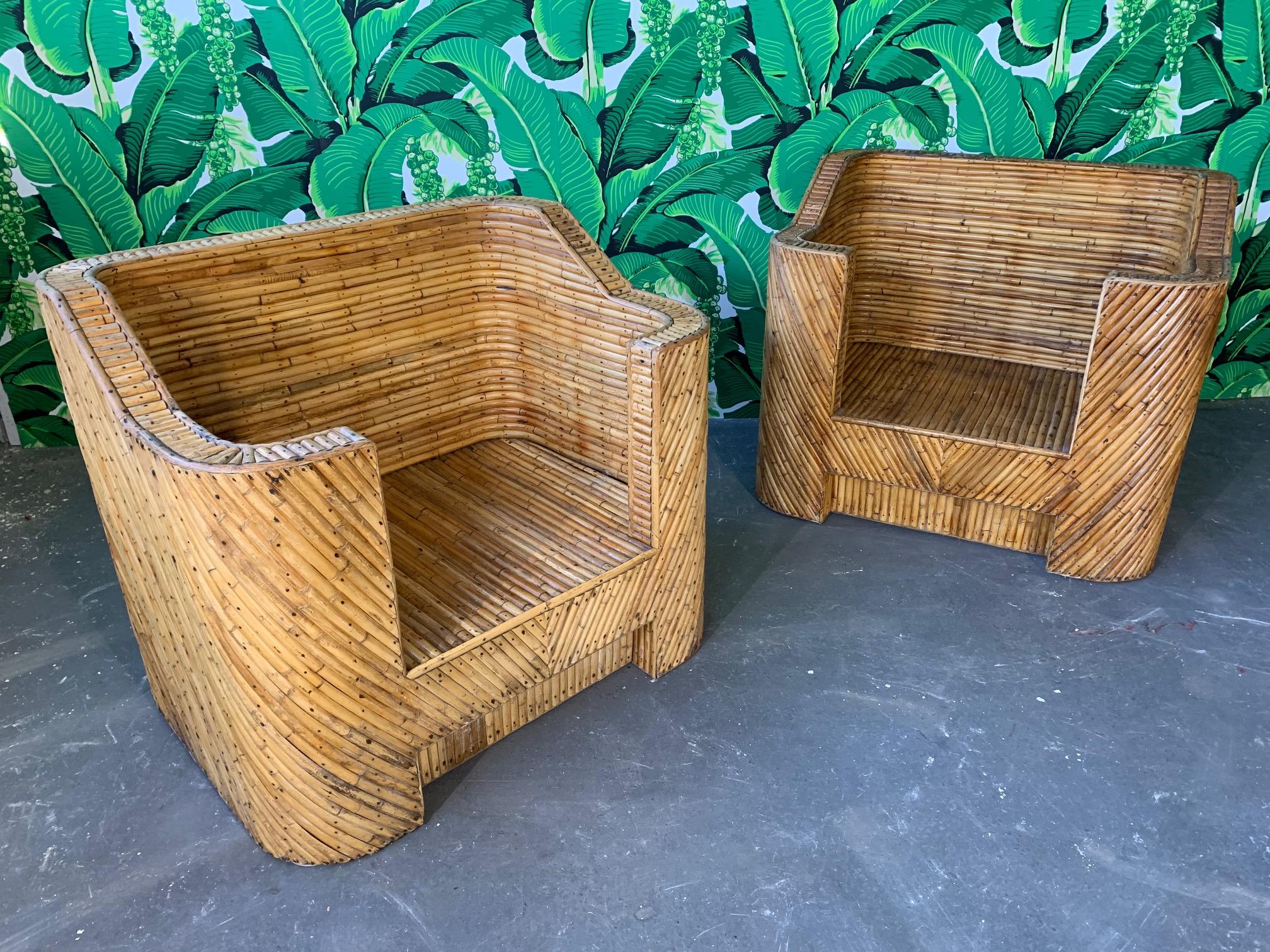 Vintage split pencil reed bamboo club chairs circa 1960s purchased by original owner in Guam. Very heavy, excellent construction, minor signs of age appropriate wear to finish.