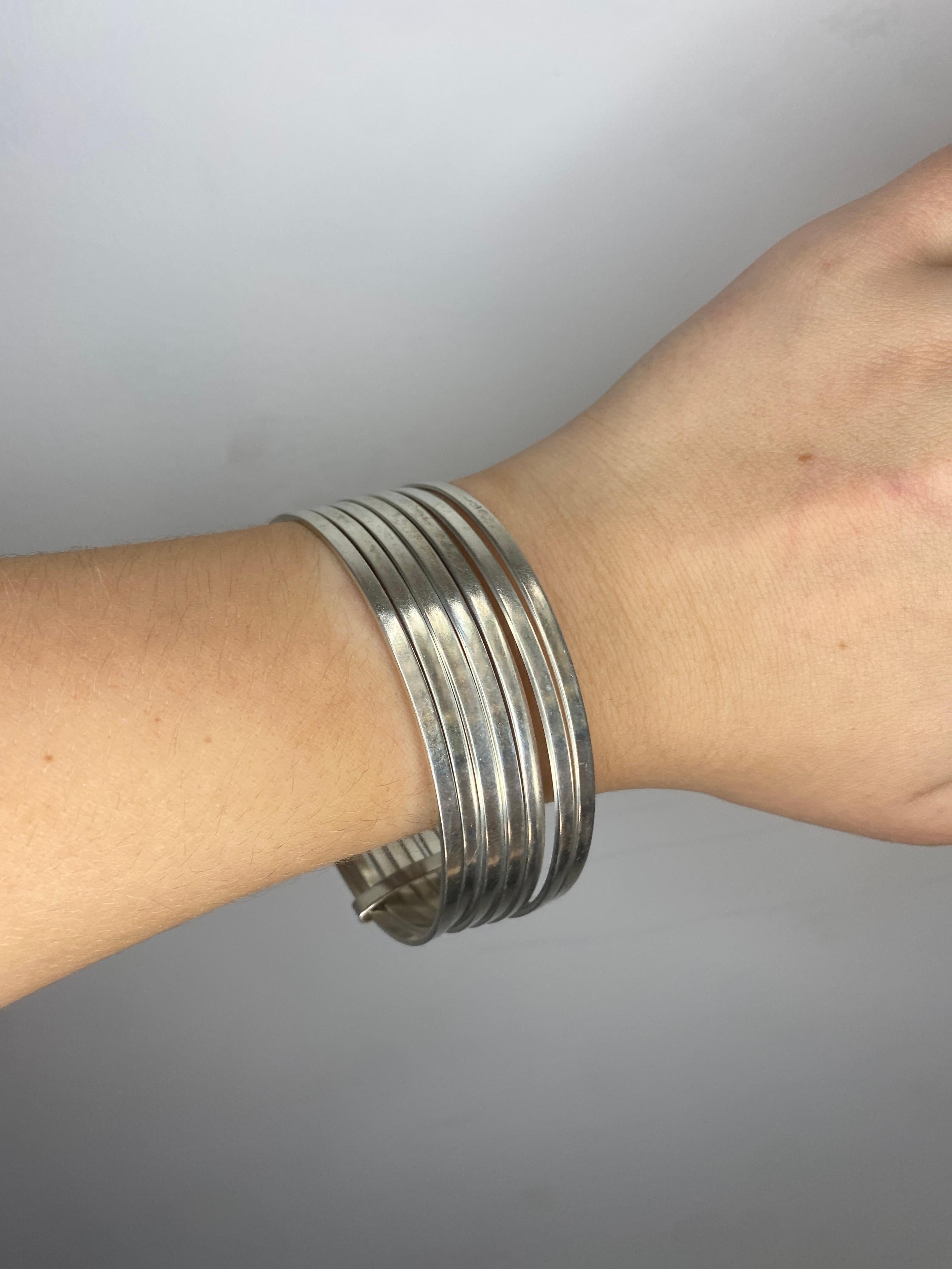 stacked silver bracelets