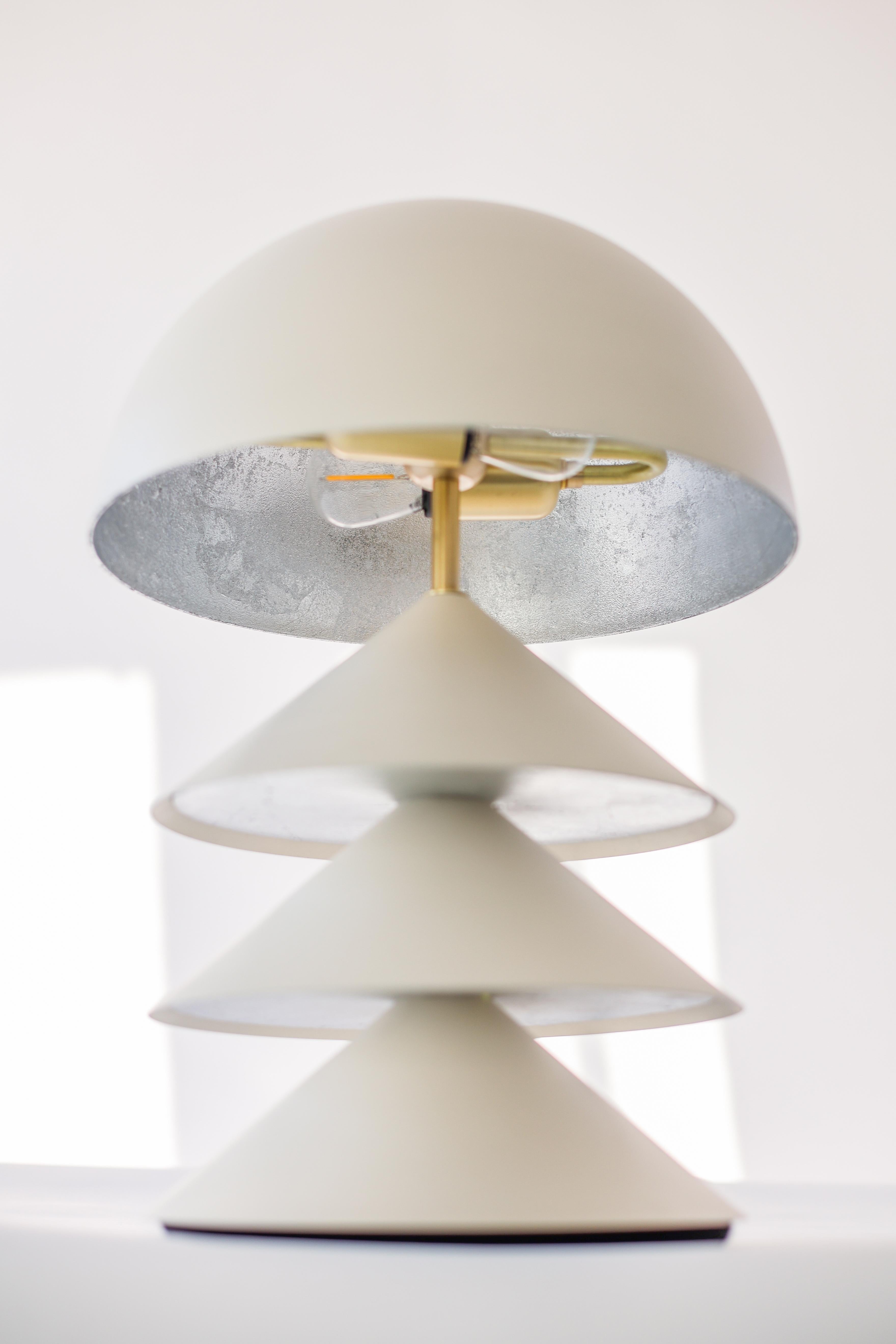 Contemporary Stacked Bone and Brass Powder-Coated Table Lamp with Peekaboo Silver Leaf Shade For Sale