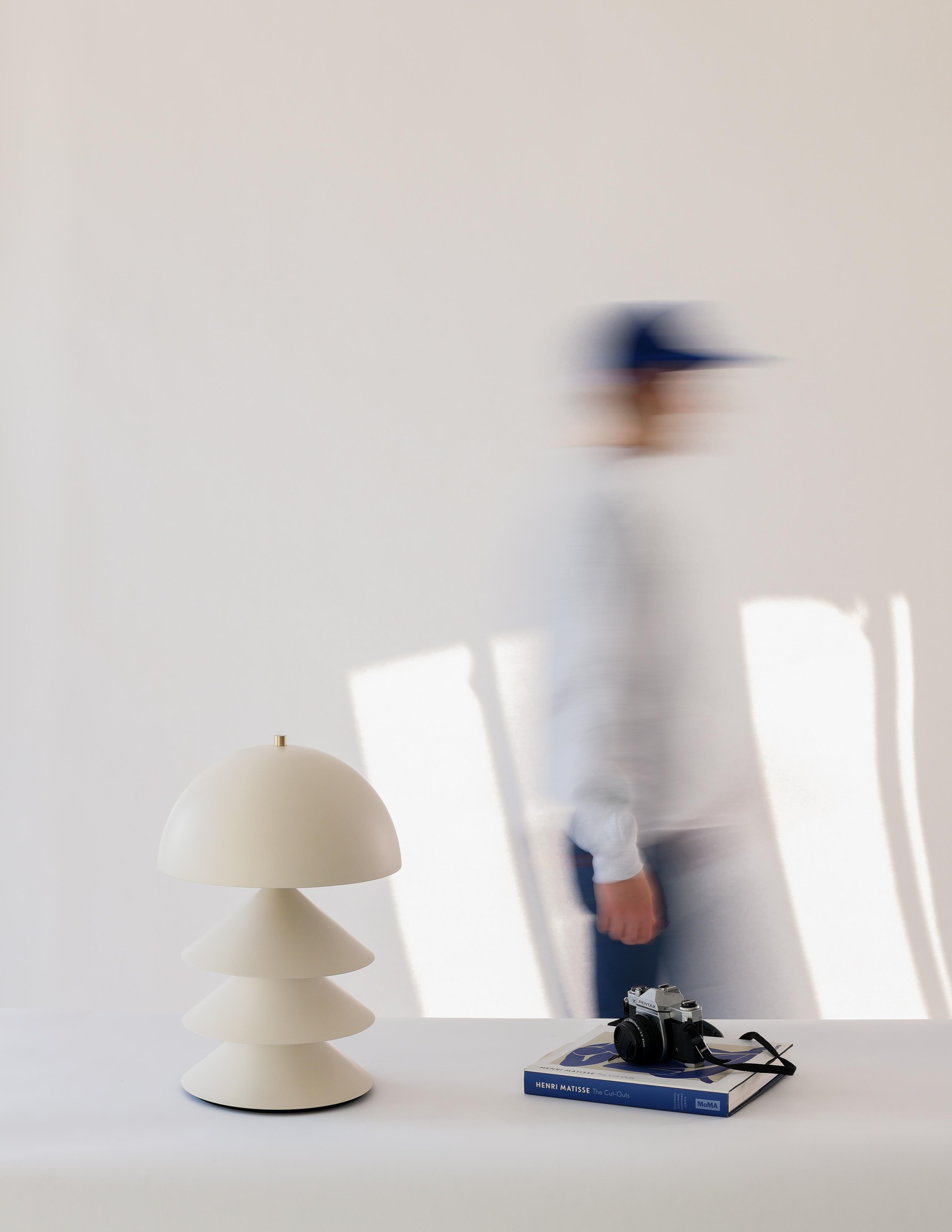 Modern Stacked Bone and Brass Powder-Coated Table Lamp with Peekaboo Silver Leaf Shade For Sale