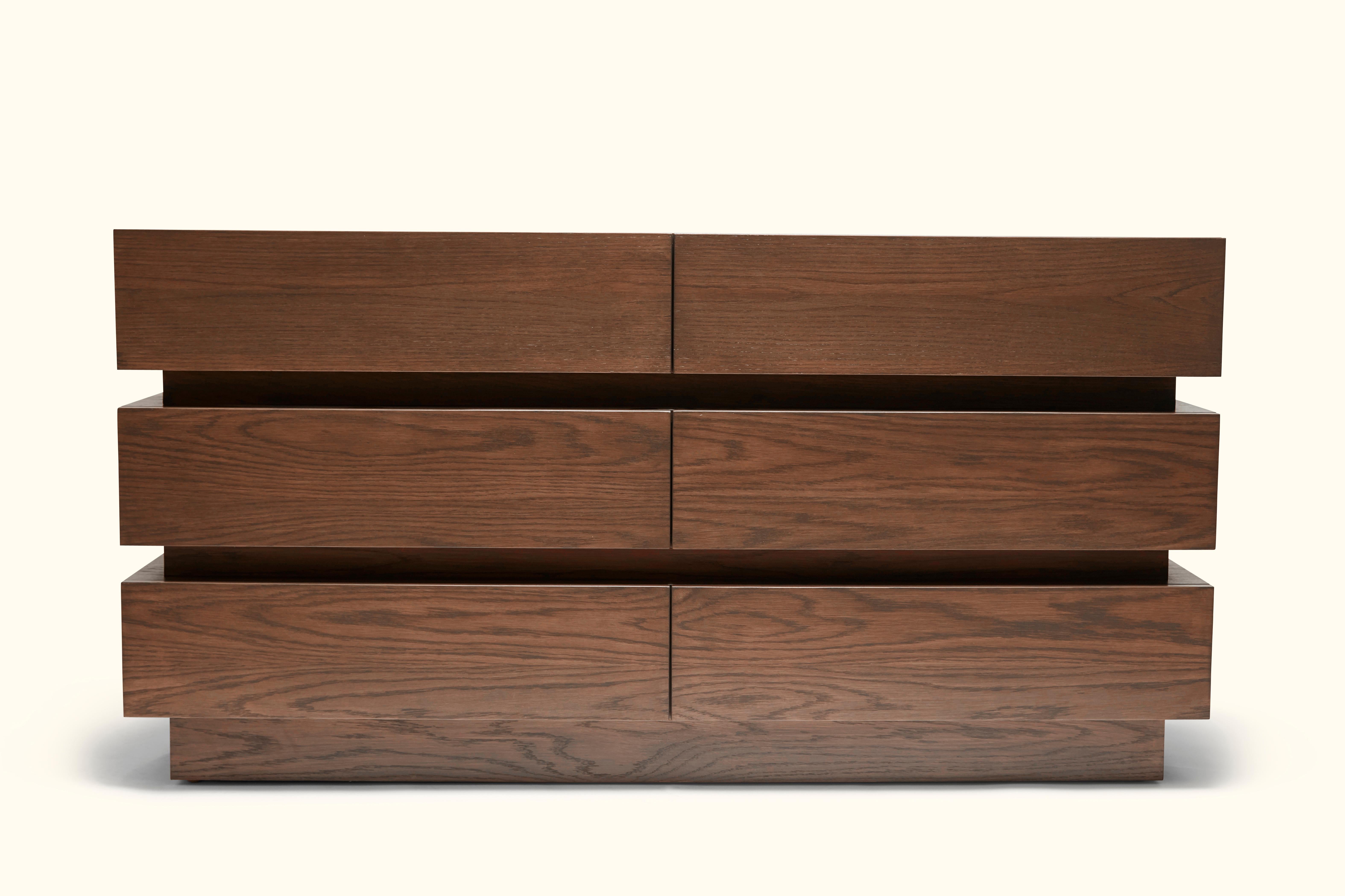 The stacked box dresser features six drawers and is made in American walnut or white oak.
