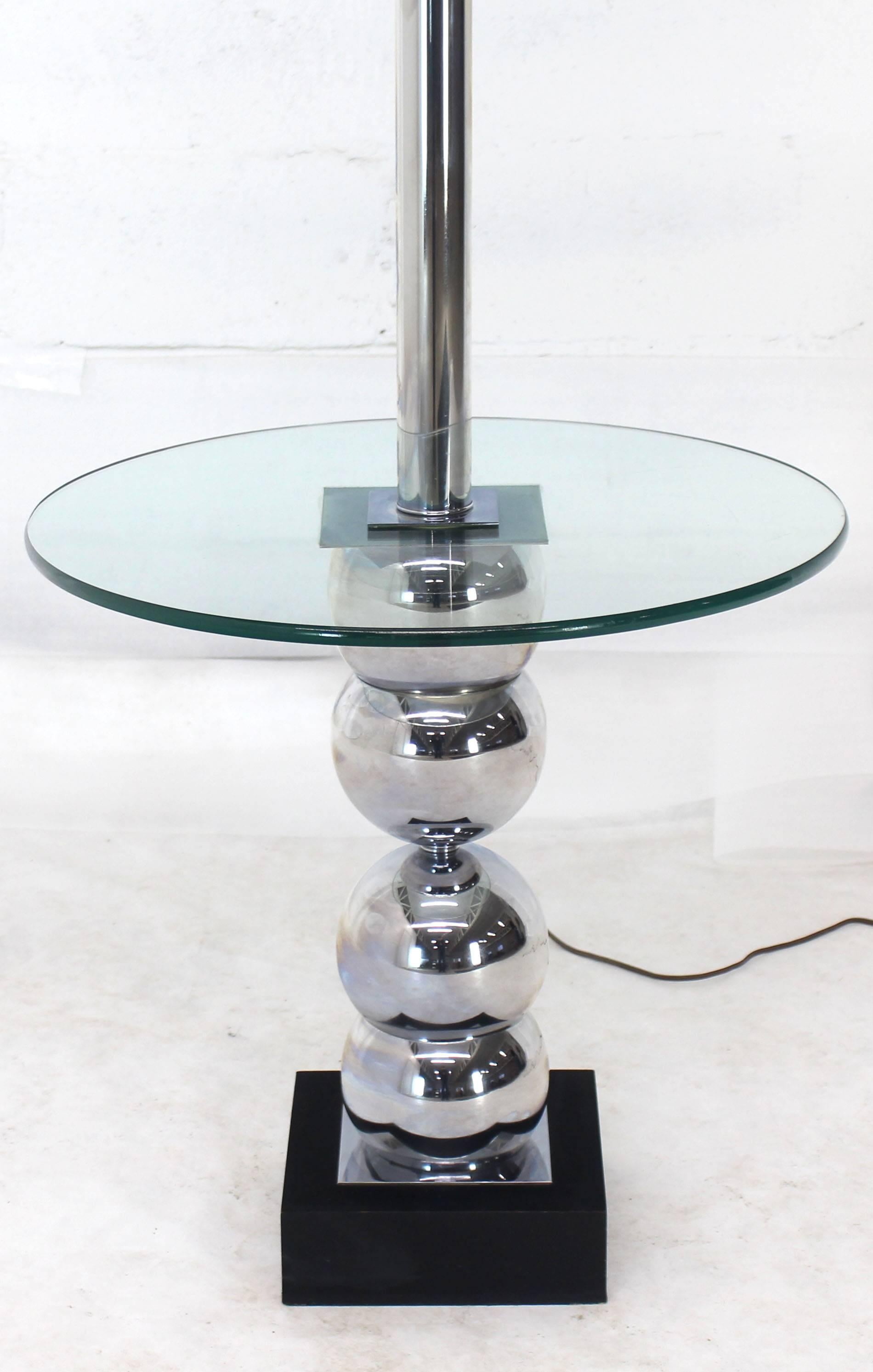 glass table with lamp attached