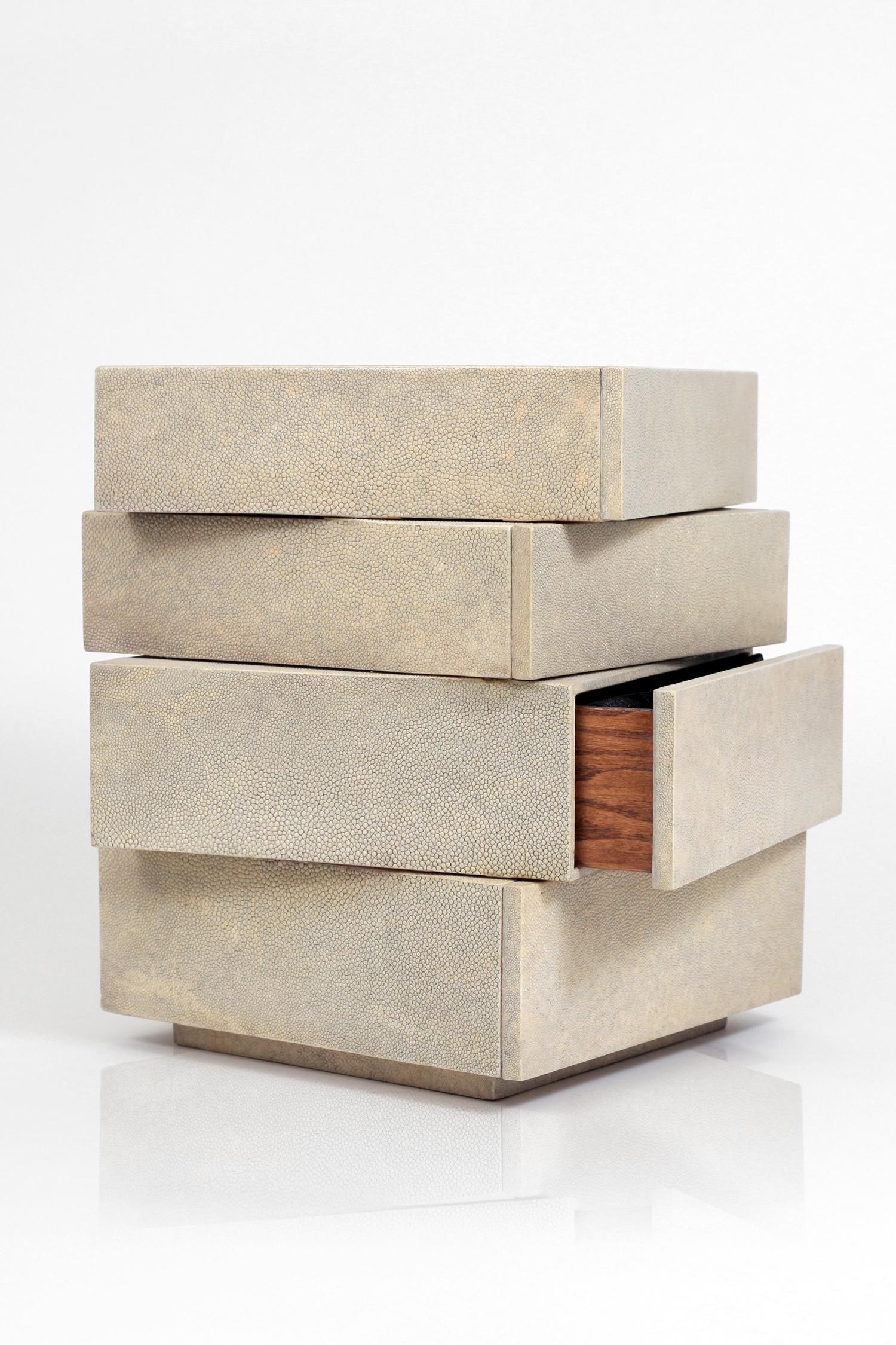 The irregular stacked jewelry chest in cream shagreen by R&Y Augousti is a stunning geometric piece to store your personal items. This piece has 4 drawer compartments that have black velvet trays. See images at end of slide of other jewelry chests