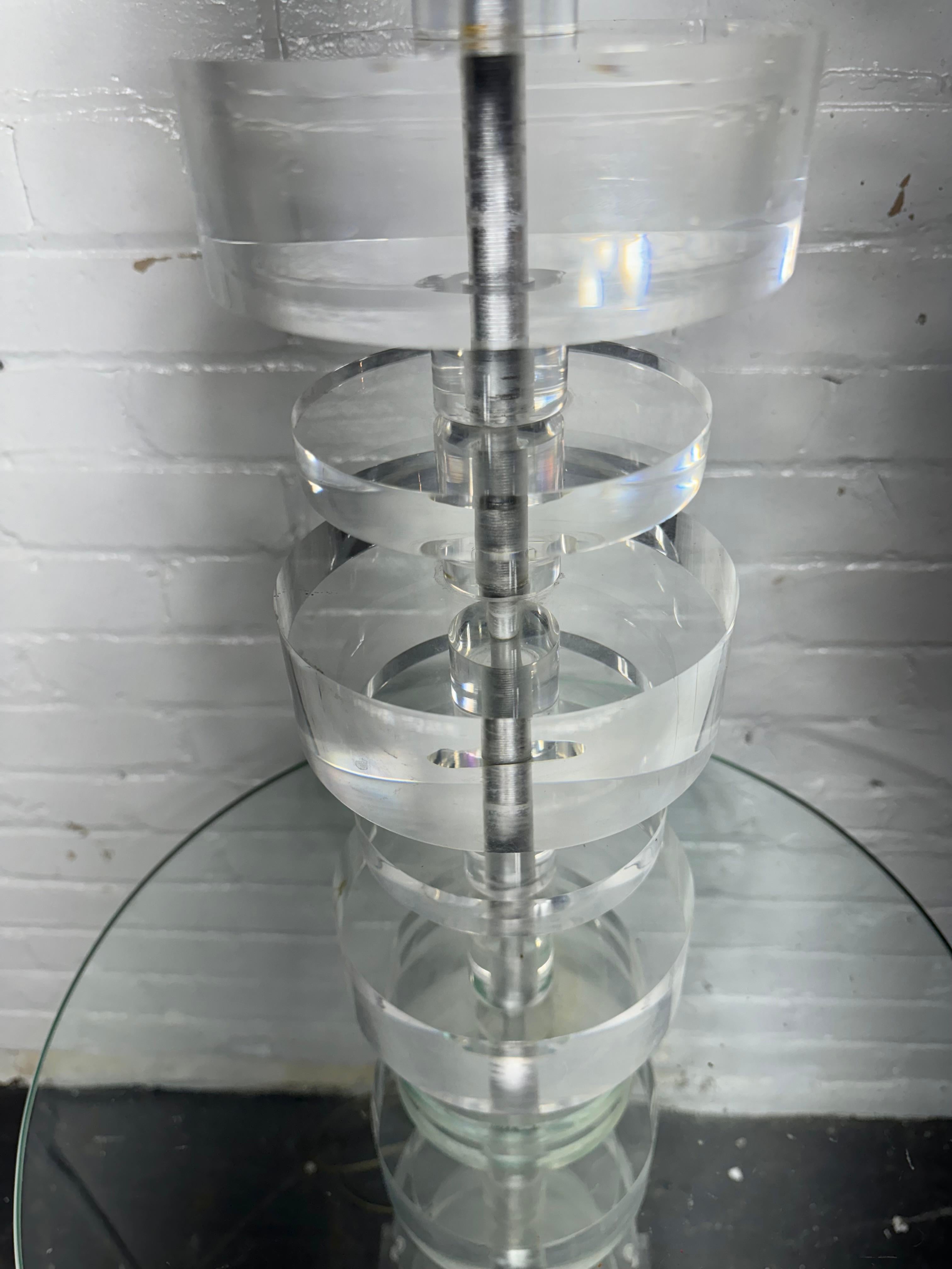 Stacked Lucite / Acrylic Lamp w/ built in table attrib. to Karl Springer.. Stunning and functional accent piece.. Lucite circular disks, various sizes.. Great design.. needs harp and lamp shade. 