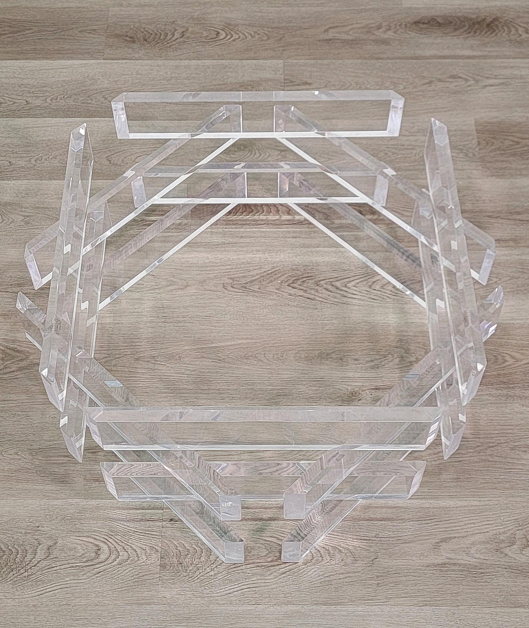 Amazing vintage lucite cocktail table base comprised of thick lucite stacked brick style in an octagon pattern. A Hollywood Regency classic that works well with modern and contemporary decors. We can provide a round, octagonal or square glass top