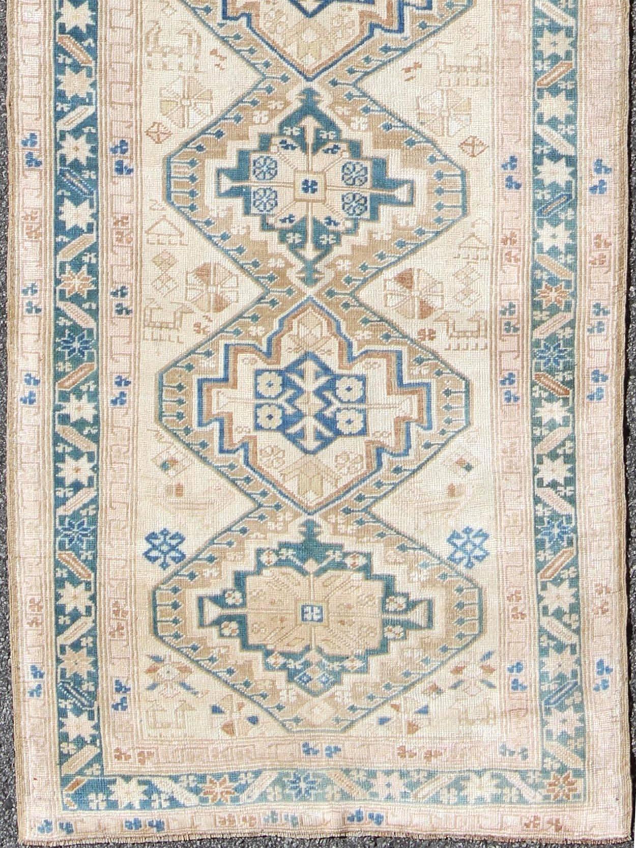 Stacked medallion antique Turkish Oushak rug in teal, ivory, cream and nude, rug na-981608, country of origin / type: Turkey / Oushak, circa 1920

This long antique Turkish gallery runner, circa 1920 features a unique blend of colors and an