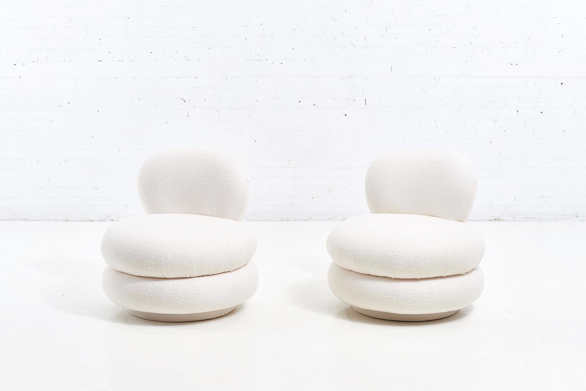 Stacked Pouf swivel lounge chairs in white boucle. Fully restored and
Reupholstered in Wool/Poly performance boucle.