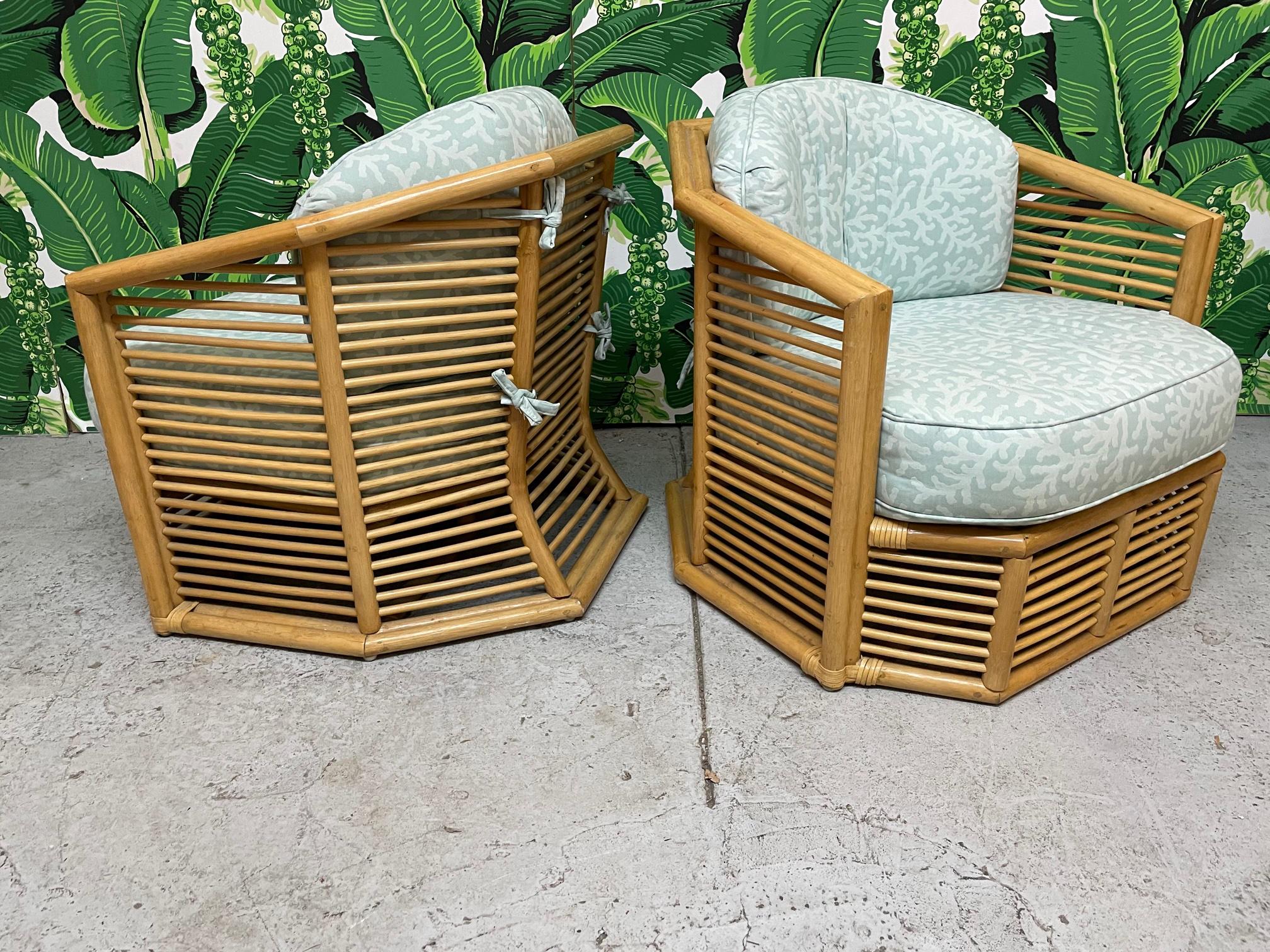 Pair of vintage rattan club chairs feature stacked horizontal fretwork in the manner of Franco Albini. Sculptural frame that flares at base. Very good condition with only very minor imperfections consistent with age.
  
 