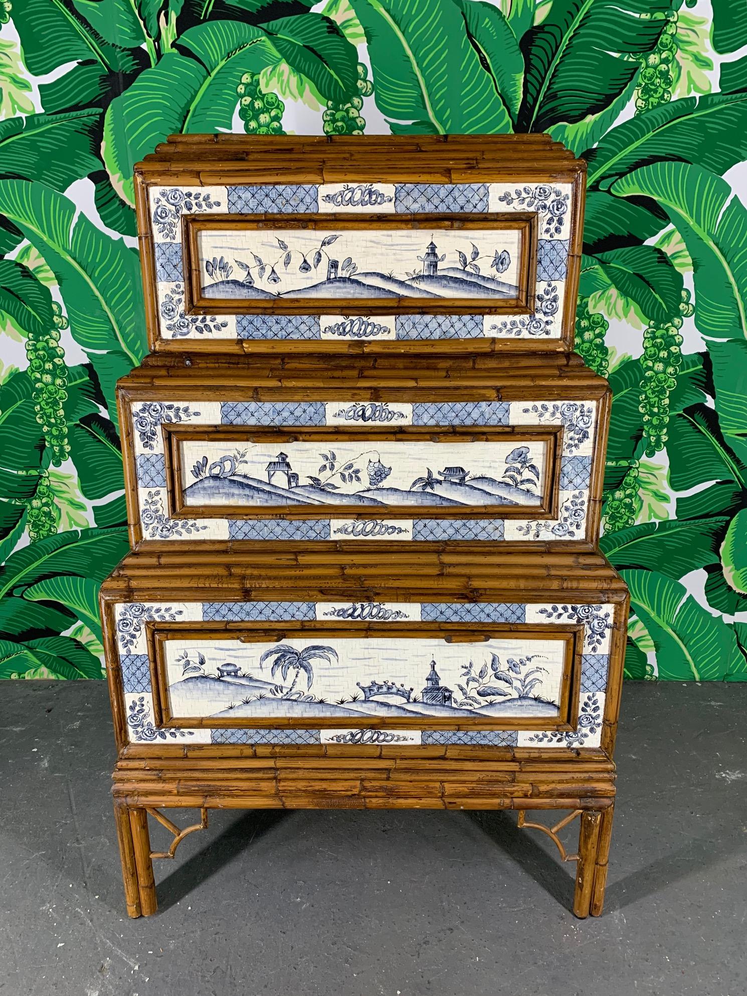 Asian style stacked dresser features hand painted detailing and geometric rattan overlay. Back is also finished in rattan, circa 1950s. Good vintage condition with minor imperfections consistent with age.