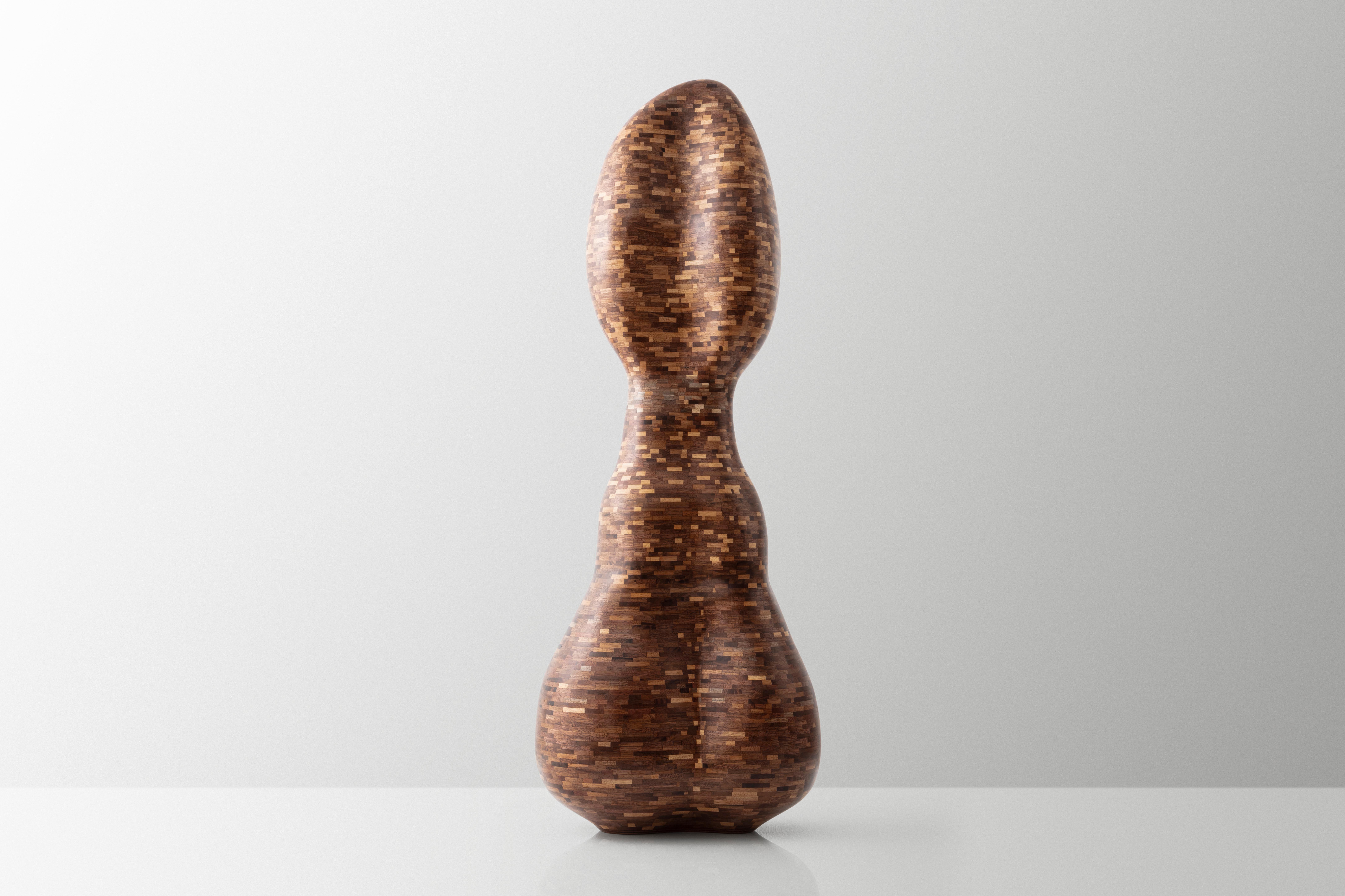 This is Richard's third free-form exploration using his signature STACKED style. As with all of his work, this sculpture was built, sculpted, and finished entirely by hand. To the confusion of many, there is no lathe work involved. The desired
