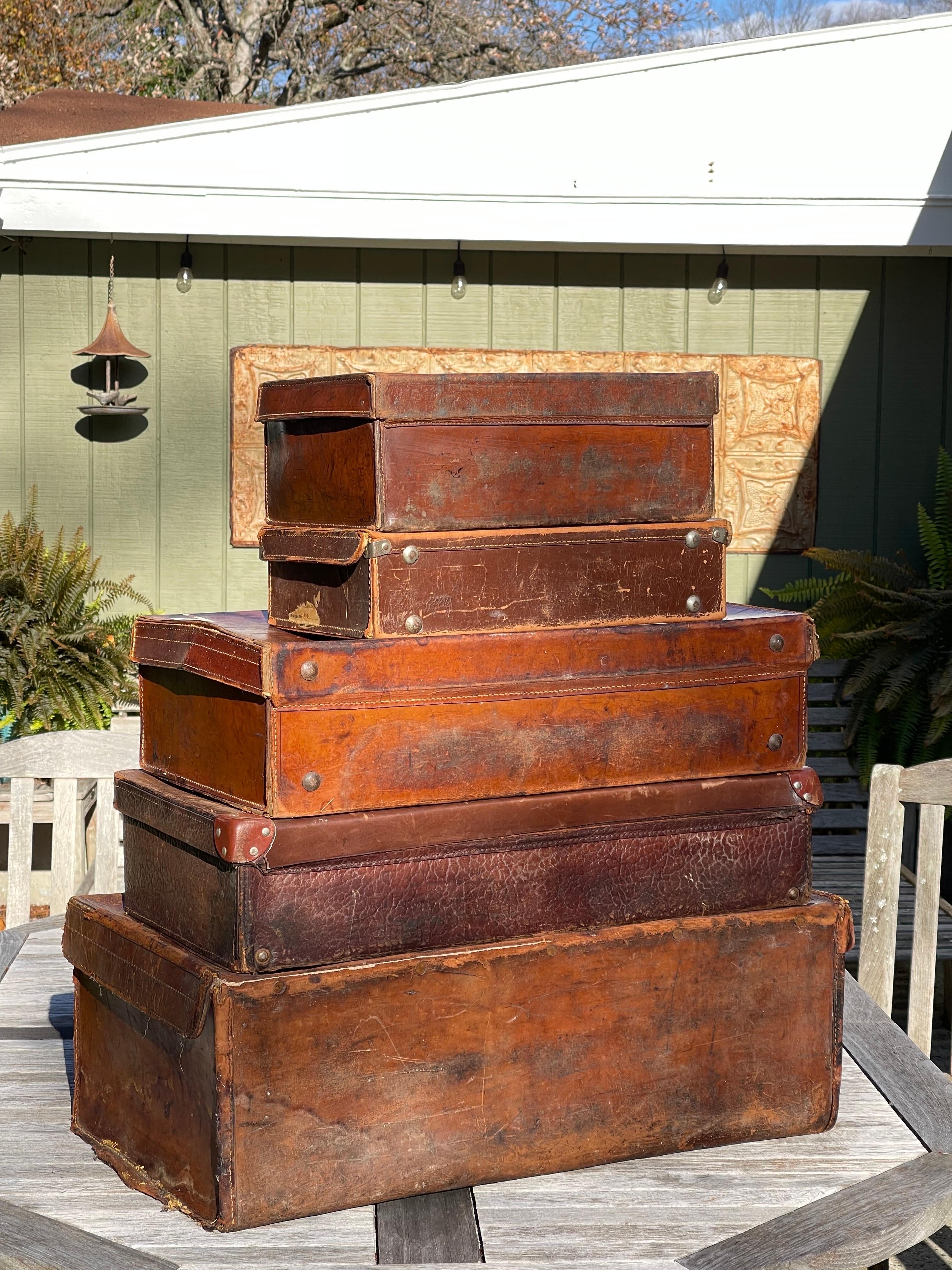 Metal Stacked Set of Five Antique Leather Suitcases or Trunks For Sale