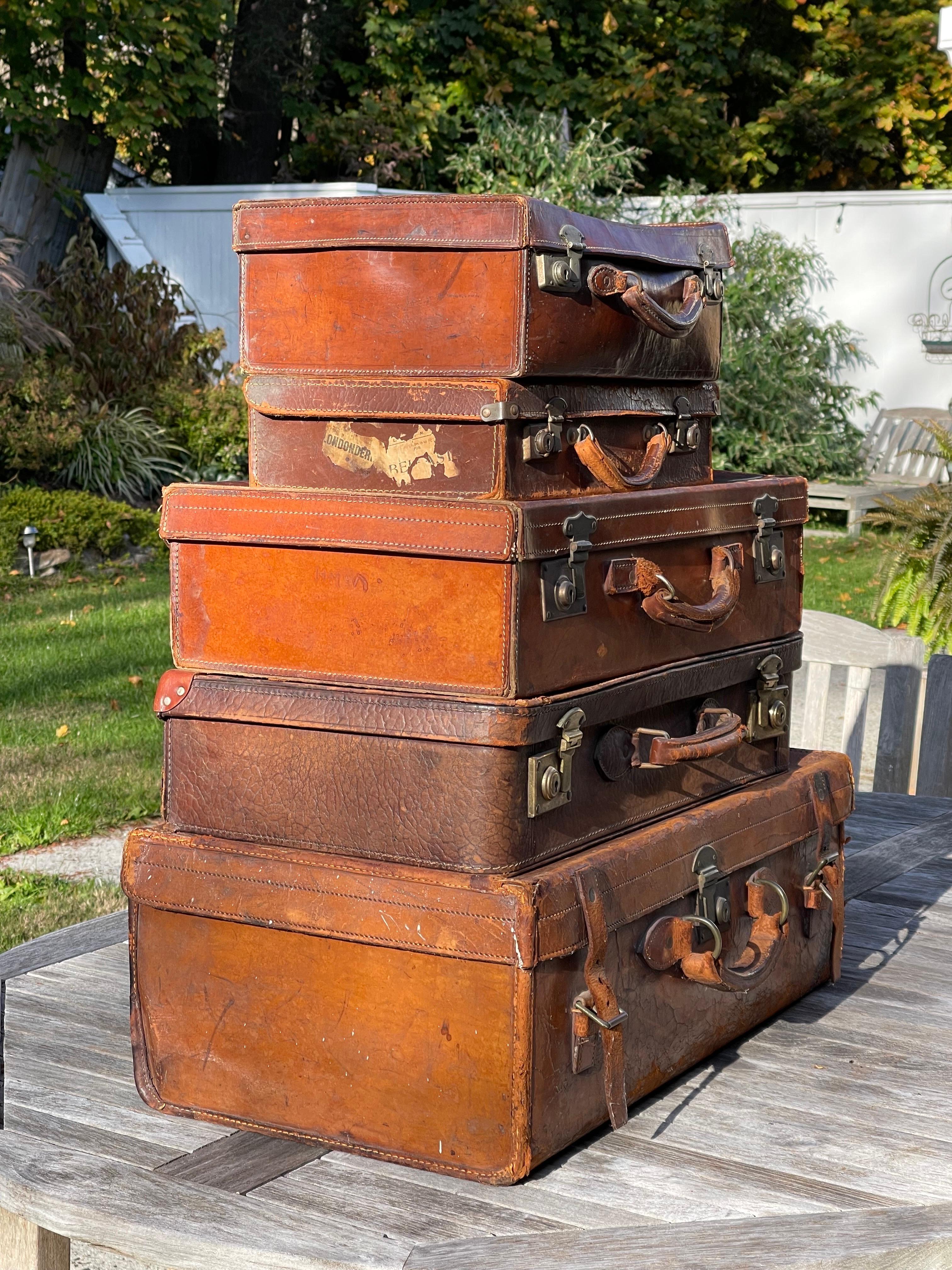 American Classical Stacked Set of Five Antique Leather Suitcases or Trunks For Sale