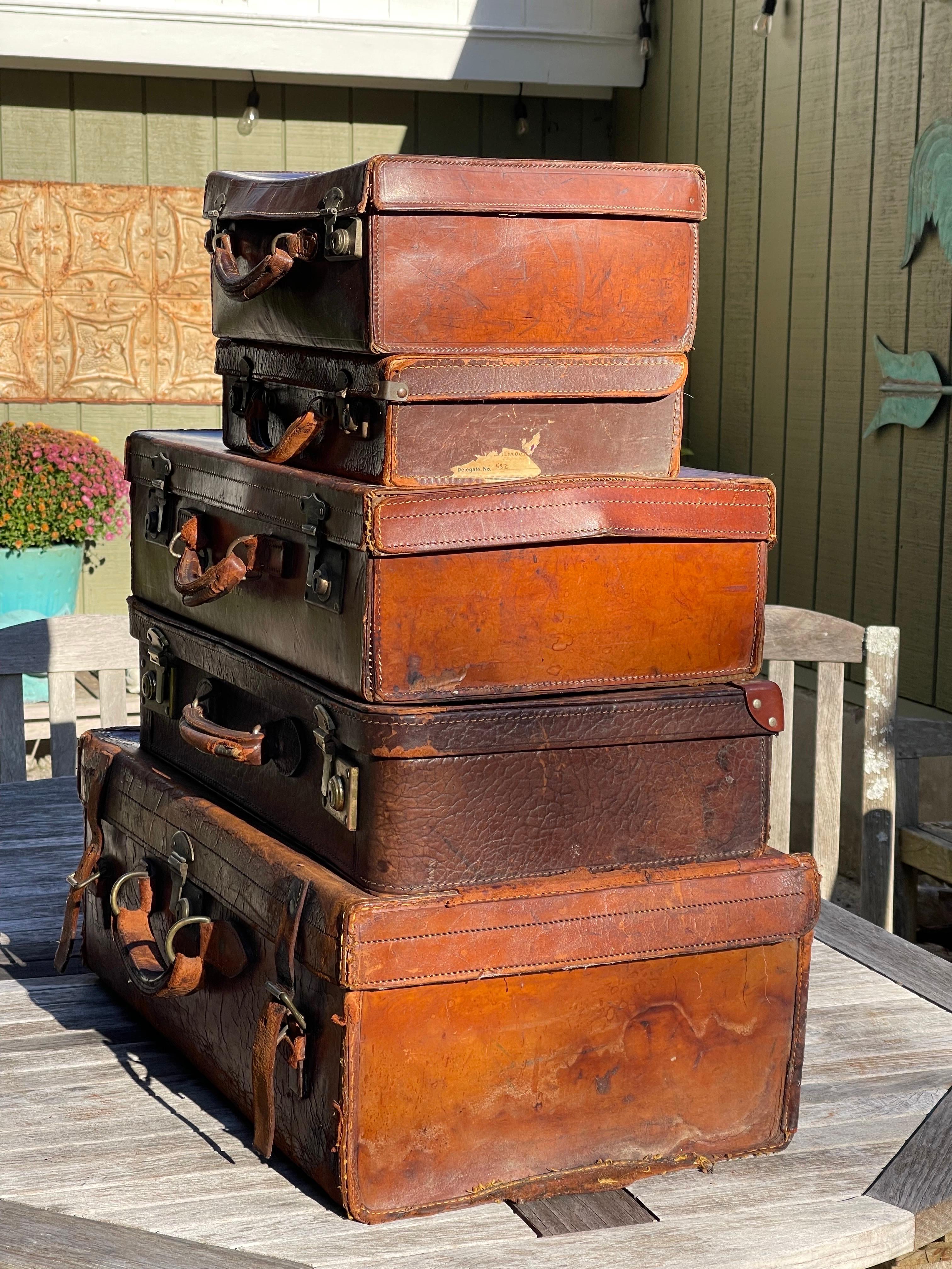 American Classical Stacked Set of Five Antique Leather Suitcases or Trunks For Sale