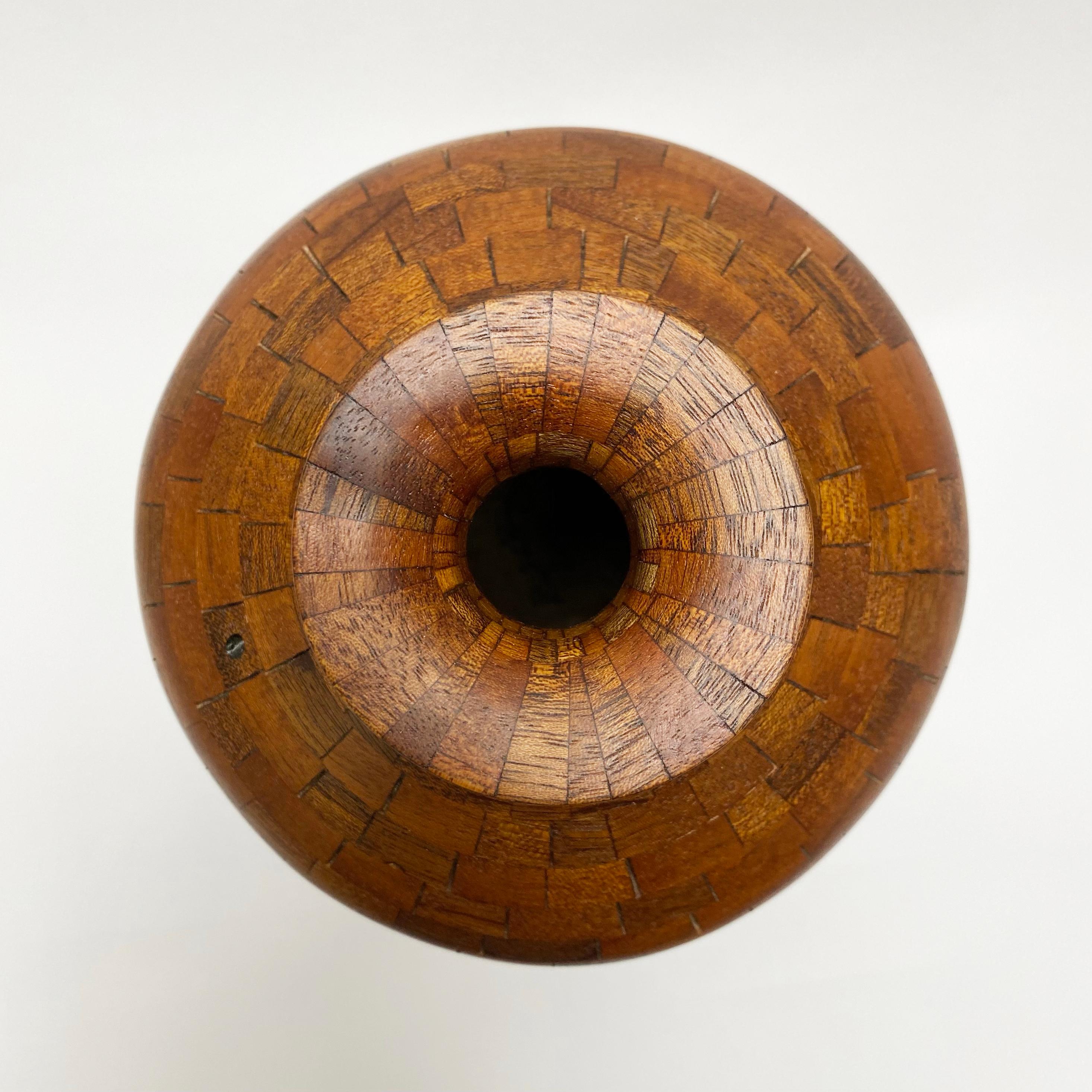Part of Richard Haining's STACKED collection, this urn shaped vessel is made from reclaimed mahogany. The salvaged mahogany came from a variety of places, including some from a 
