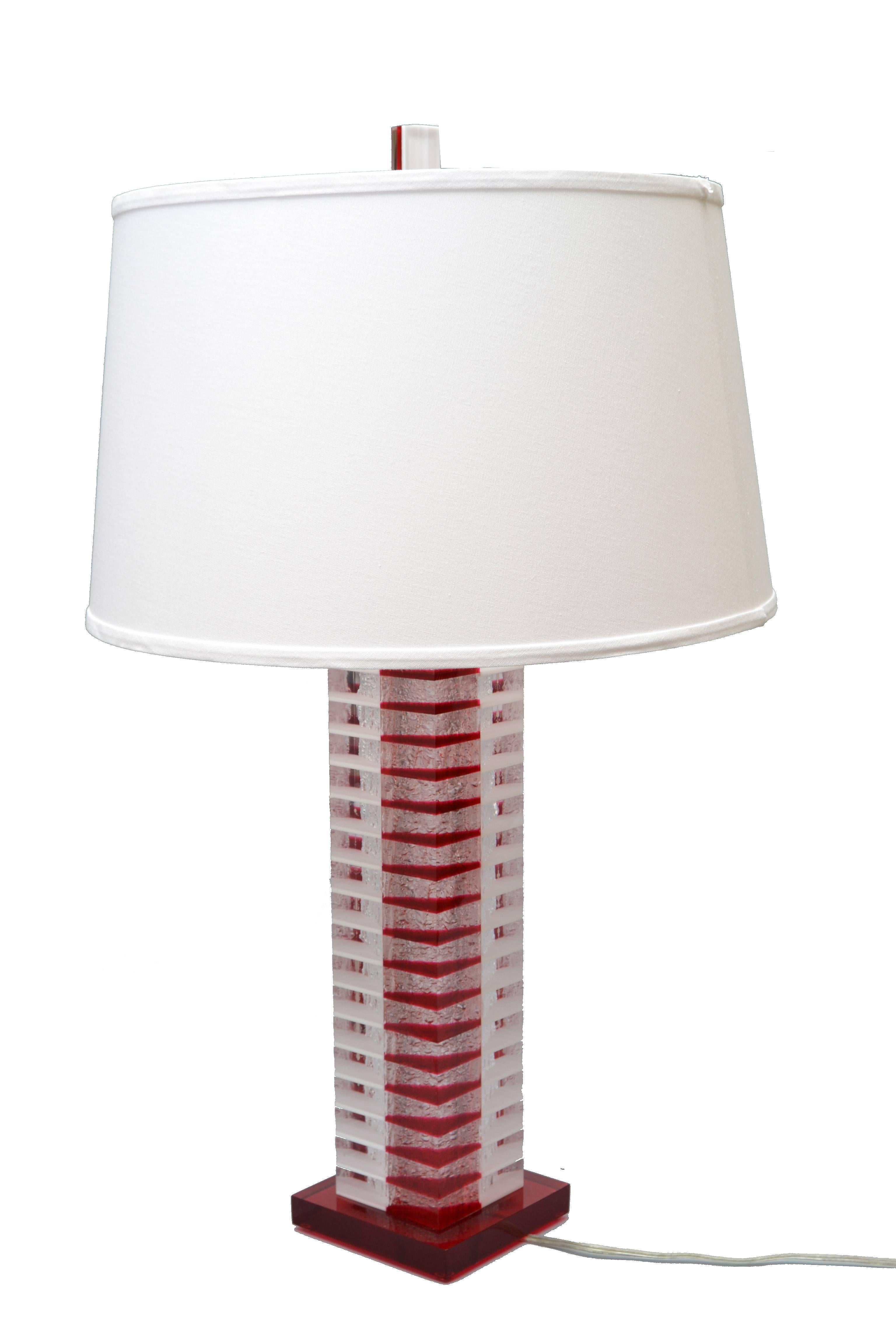 Modern Lucite table lamp in red, white and transparent Lucite pieces with Nickel Hardware. 
Wired for the U.S. and uses a regular or LED light bulb.
The shade is not included.
Measures: Height to top of socket: 22.5 inches.
