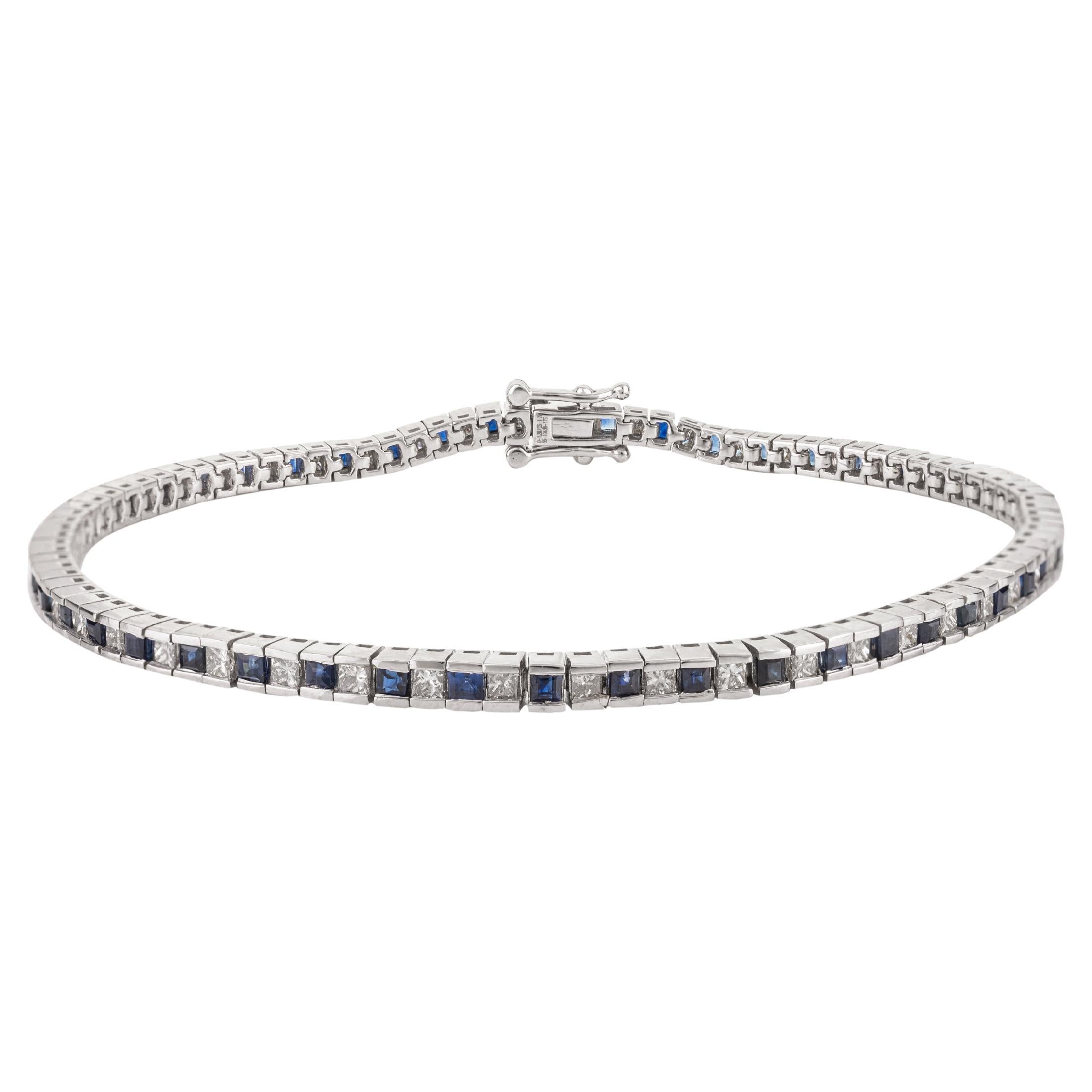 Bracciale tennis alternato con diamanti e zaffiri blu in oro bianco 18 ct.