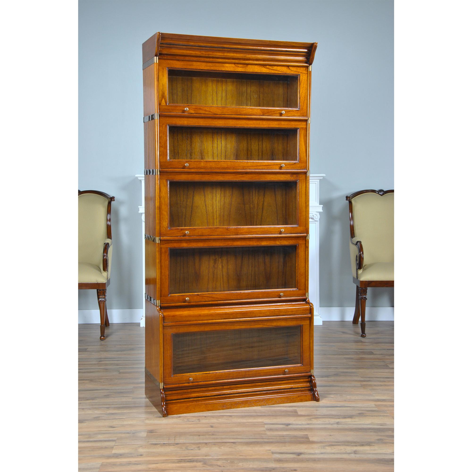 This great quality Stacking Bookcase from Niagara Furniture consists of seven separate pieces: a cap, a base and five glass sections. Beginning at the bottom; the oversized atlas sized base glass fronted section is a real bonus for all the larger