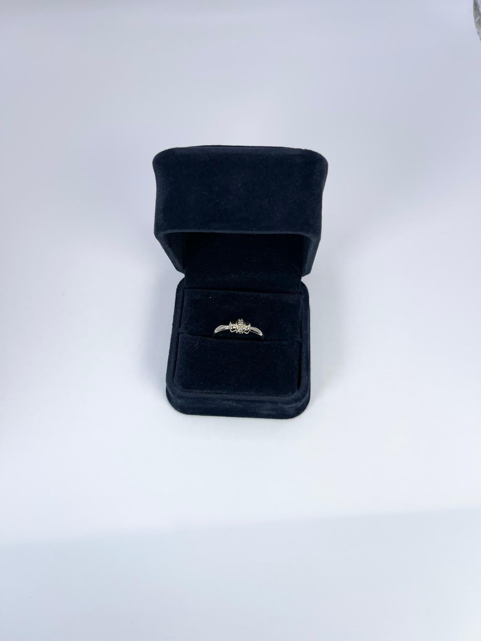 Stunning diamond ring, stacking modern style in 14KT white gold.

GRAM WEIGHT: 4.07gr
GOLD: 14KT white/yellow gold

NATURAL DIAMOND(S)
Cut: Round Brilliant 
Color: G-H (average)
Clarity: SI (average)
Carat: 0.06ct
Size: 7 (can be re-sized)
Item#:
