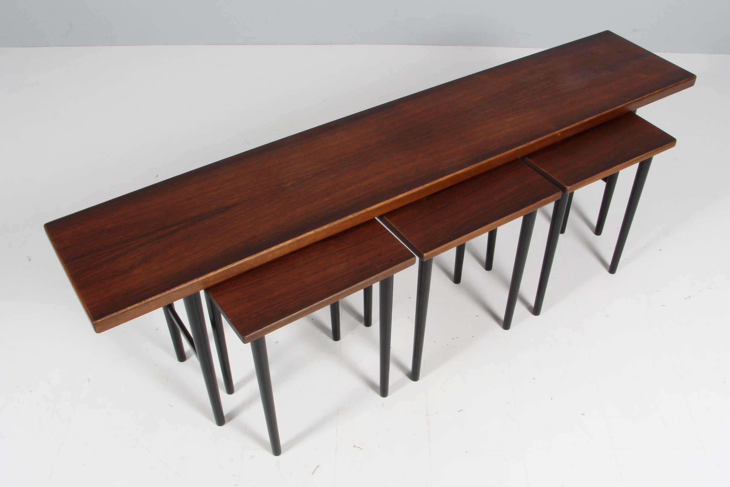 Kurt Østervig stacking table in rosewood.

Legs of black lacquered wood.

Made by Jason.