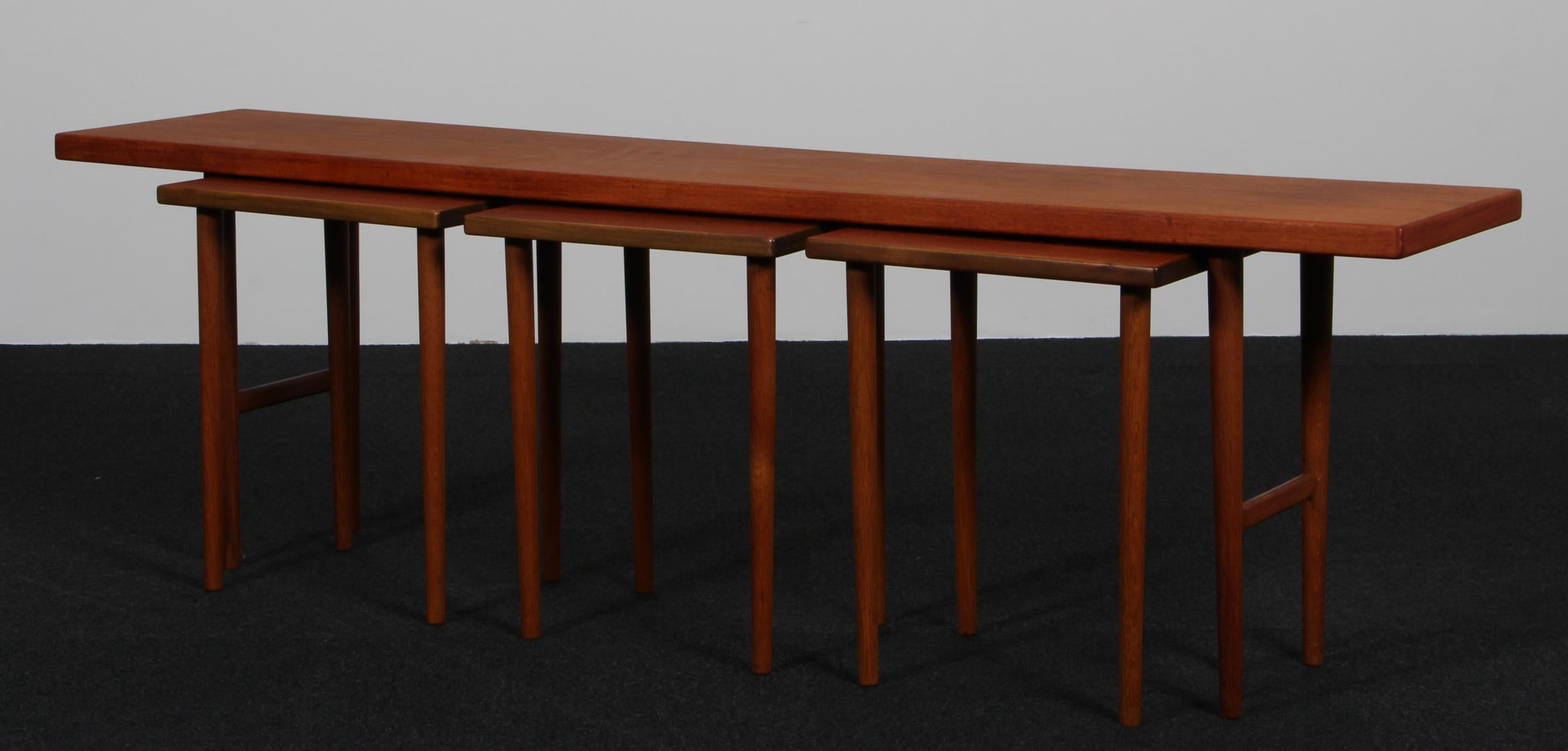 Kurt Østervig stacking table in teak.

Legs of oak.

Made by Jason.
