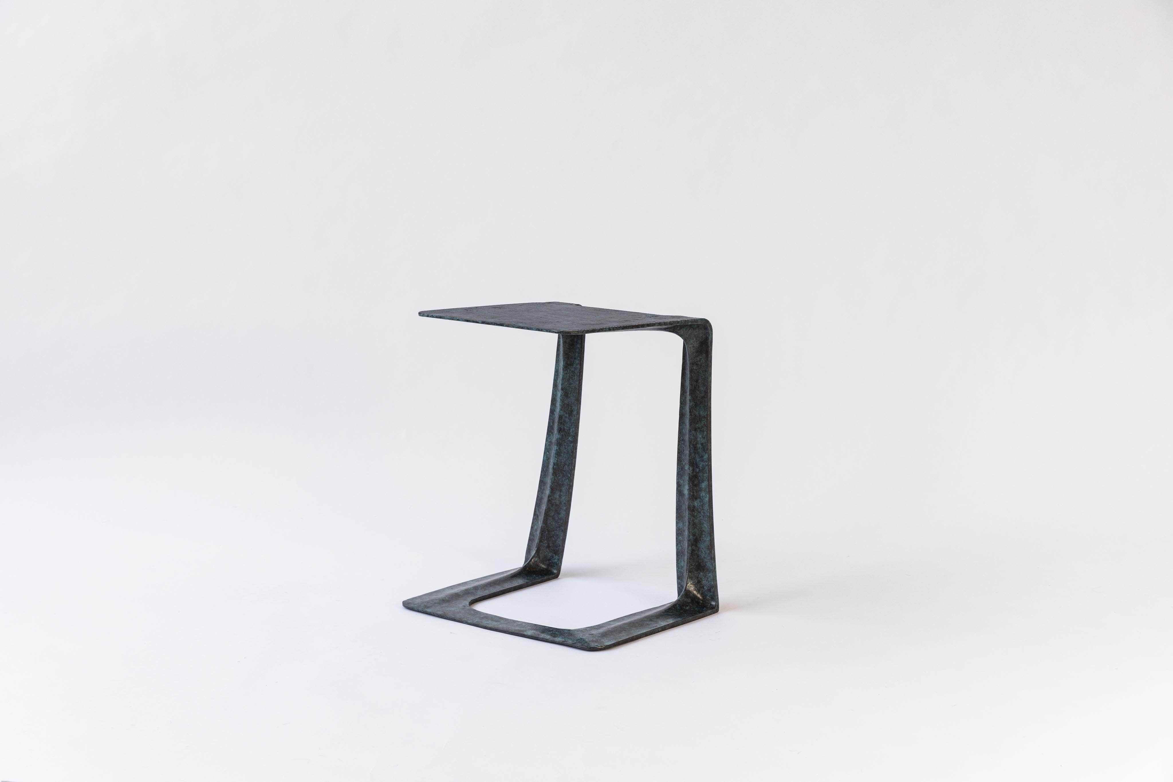 The most recent addition to the Garrison Series is a Green/Blue patina variant of the initial award-winning design conceived in early 2015. The Garrison is a sculptural casting intended for use as a stool or side table, derived from state-of-the-art