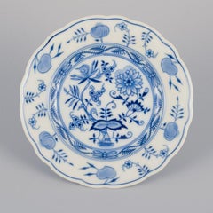 Stadtmeissen, Germany. Three Blue Onion pattern plates and a condiment set.