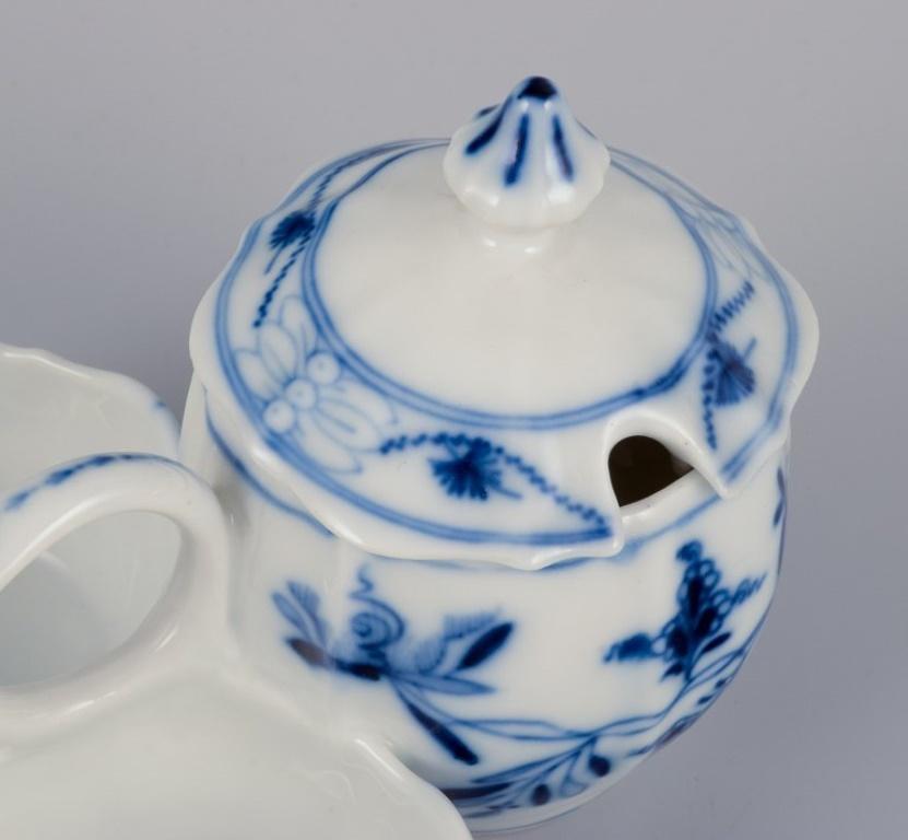 Porcelain Stadtmeissen, Germany. Three Blue Onion pattern plates and a condiment set.  For Sale