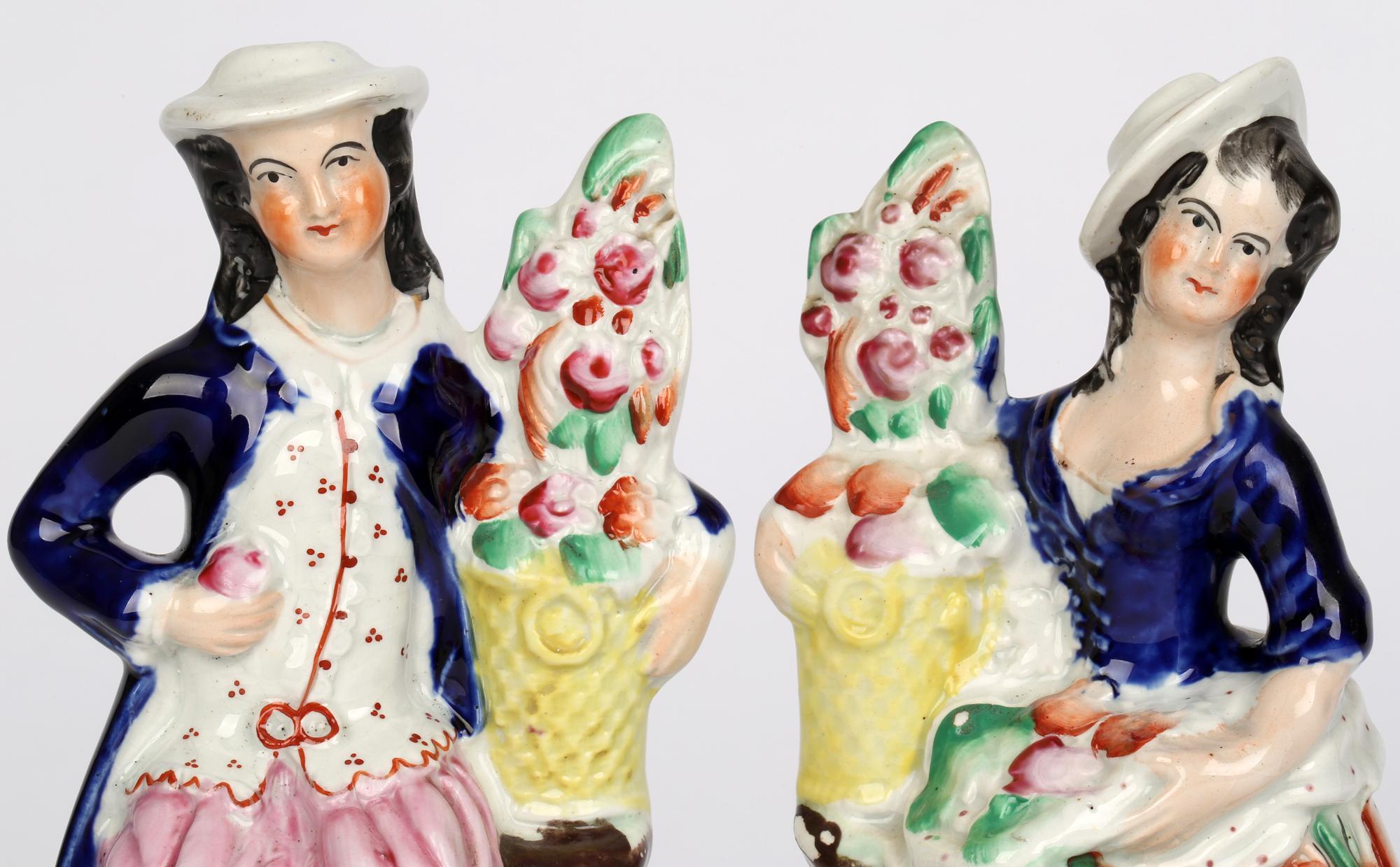 Hand-Painted Staffordshire Antique Pair Figures with Baskets Containing Flowers For Sale