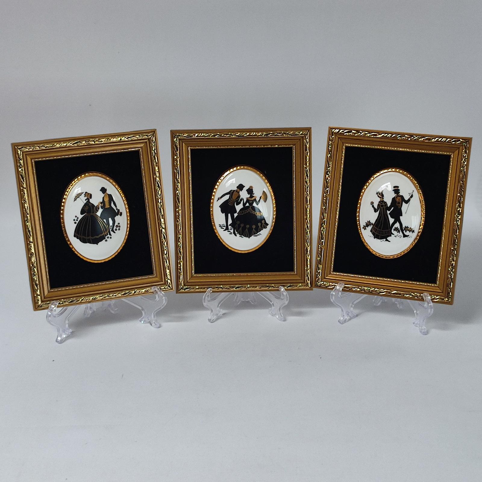 Set of 3 Staffordshire silhouette images framed on porcelain medallions (black gold), with black velvet background.
These beautiful Fine Bone China Frame Wall Art Silhouettes add a touch of romance to your home. The intricate Rococo design features